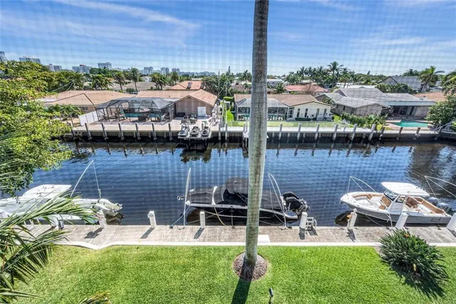 a view of a lake with a table and chairs