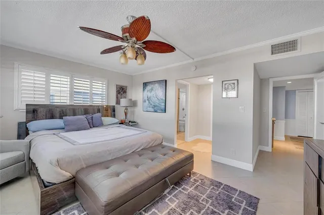 a kitchen with cabinets and stainless steel appliances
