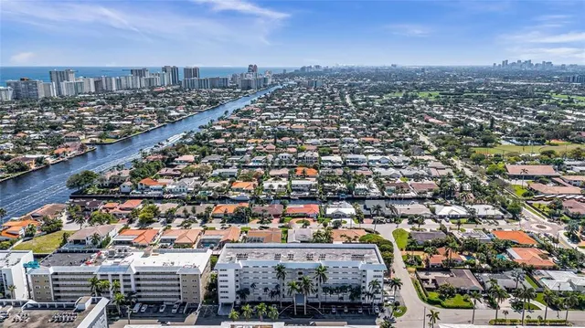 a view of a chairs and table in patio with a yard