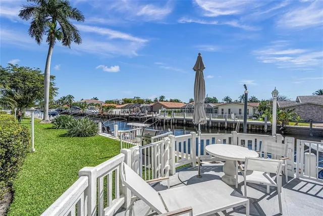 a view of a swimming pool with a lounge chair