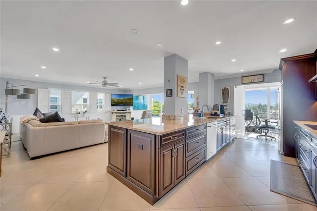 a large kitchen with stainless steel appliances lots of counter top space