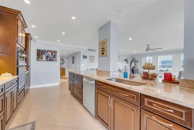 a large kitchen with stainless steel appliances lots of counter top space