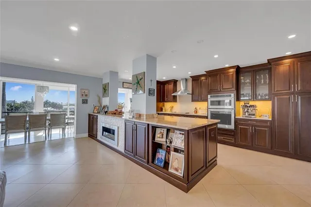 a kitchen with stainless steel appliances granite countertop a stove and a refrigerator