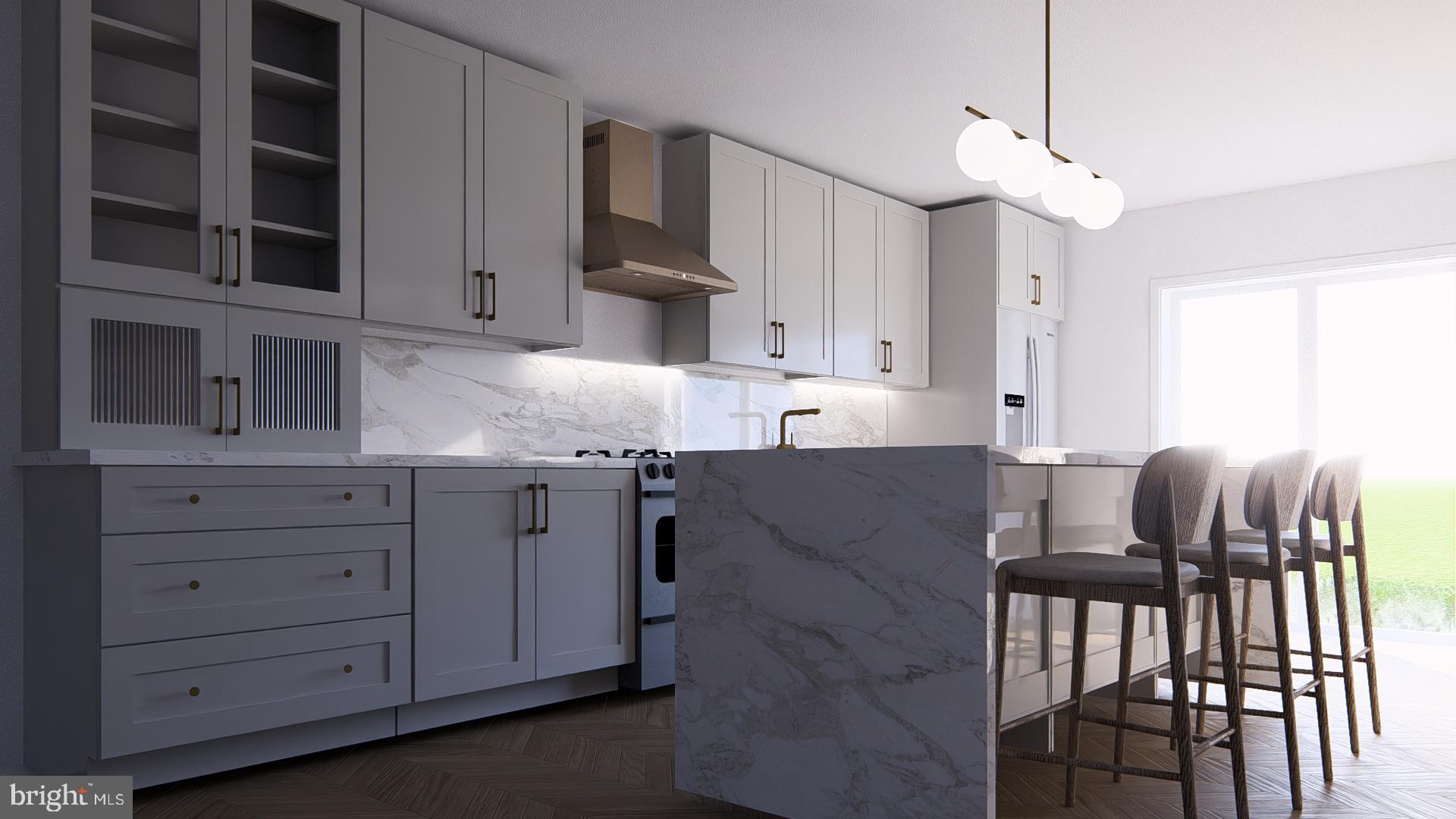 2429 Hartranft Street Philadelphia, PA 19145 - Photo 2 of 20 a kitchen with cabinets appliances and a dining table