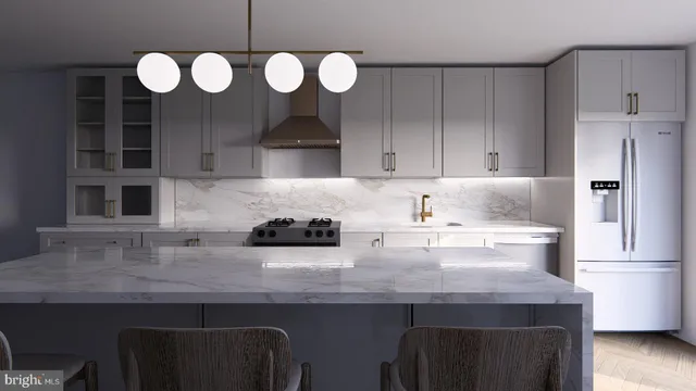a kitchen with a sink cabinets and stainless steel appliances