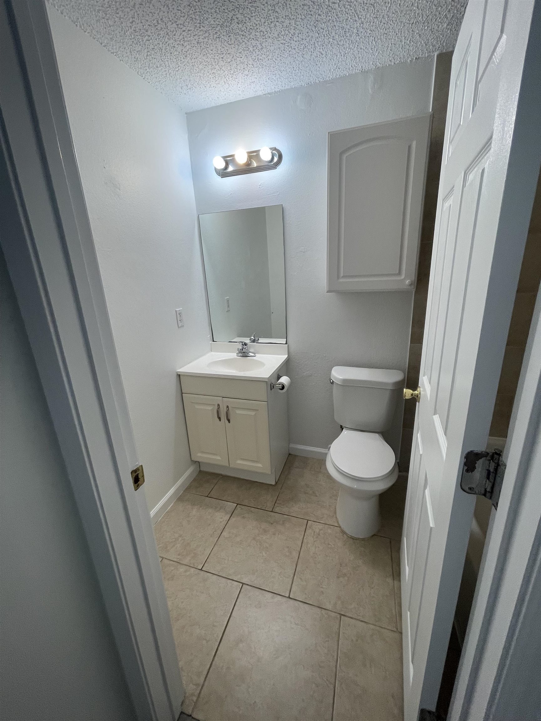 4420 Carter Road, Unit 23 St. Augustine, FL 32086 - Photo 8 of 16 a bathroom with a toilet sink and mirror