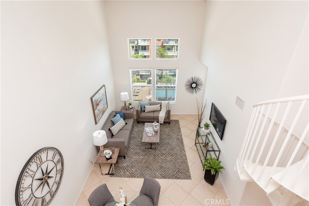 12664 Chapman Avenue, Unit 1402 Garden Grove, CA 92840 - Photo 1 of 57 a living room with furniture and a window