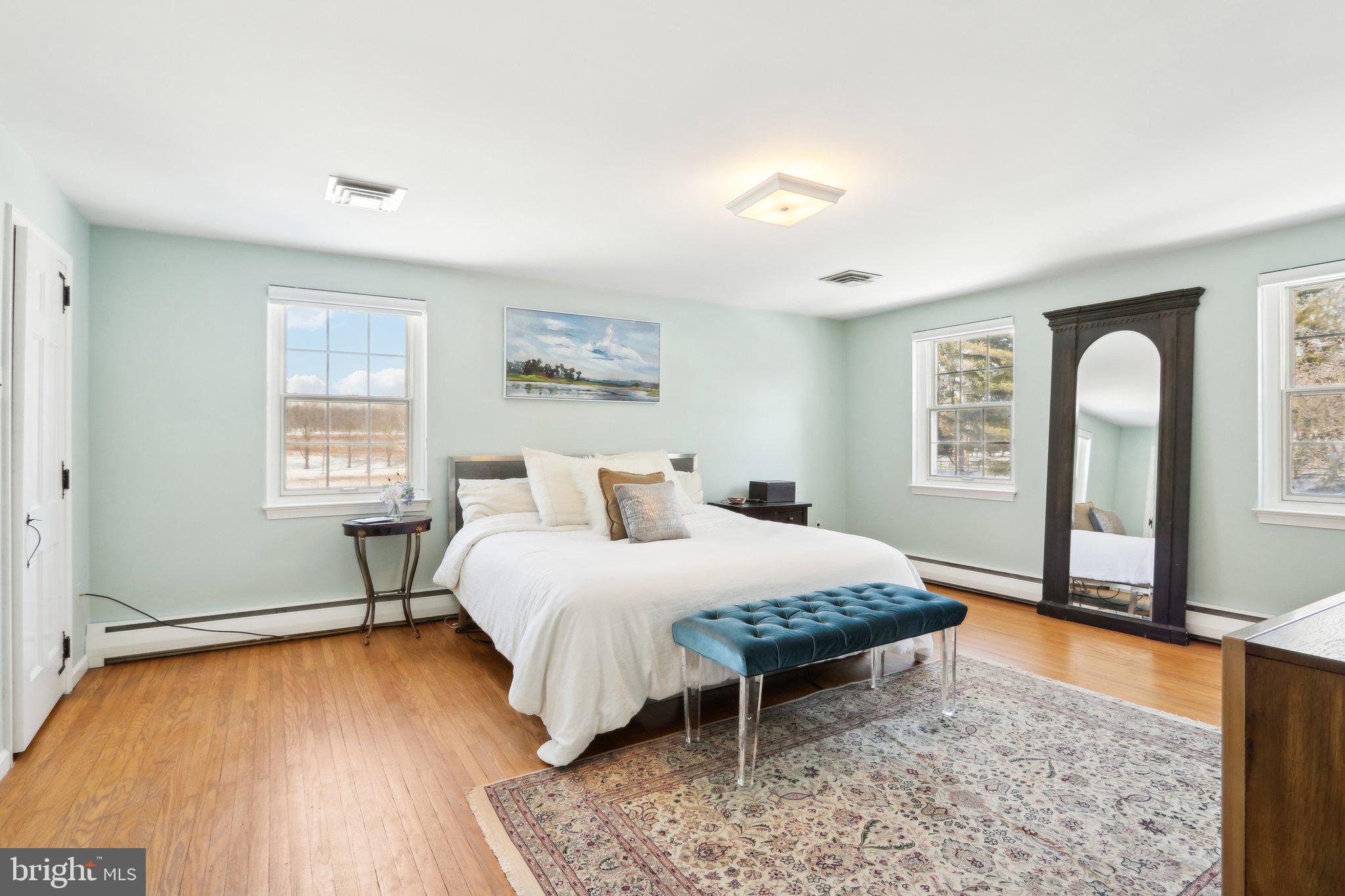 416 Dutton Mill Road Malvern, PA 19355 - Photo 29 of 56 a bedroom with a large bed and a window