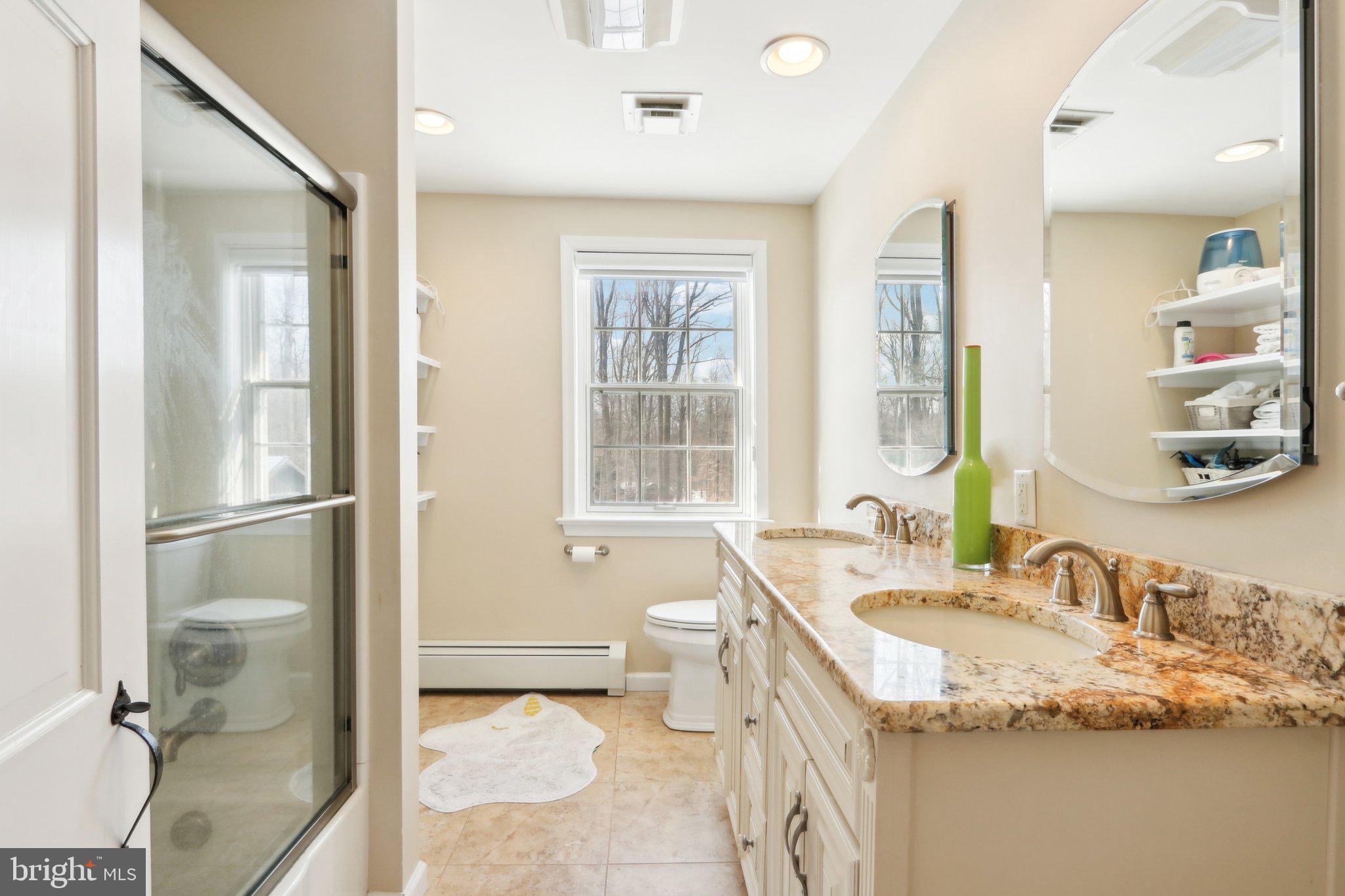 416 Dutton Mill Road Malvern, PA 19355 - Photo 34 of 56 a bathroom with a granite countertop sink toilet and shower