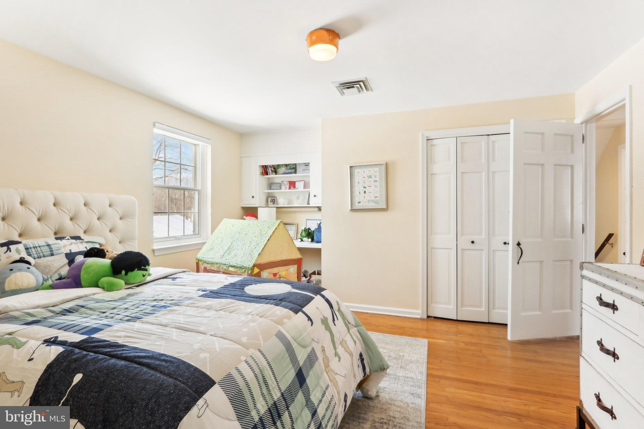 416 Dutton Mill Road Malvern, PA 19355 - Photo 35 of 56 a bedroom with a bed and wooden floor