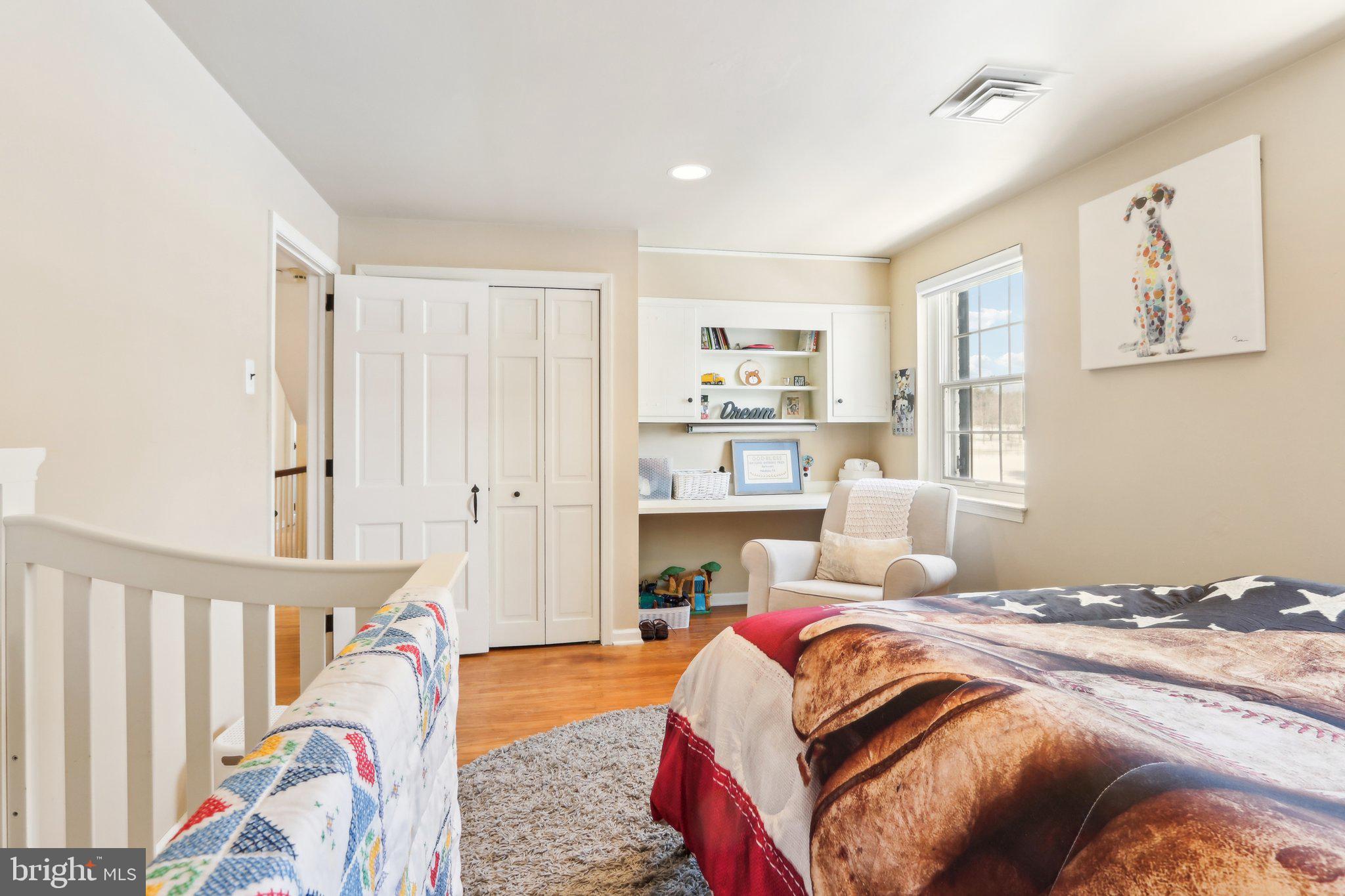 416 Dutton Mill Road Malvern, PA 19355 - Photo 36 of 56 a bed room with a bed and a couch