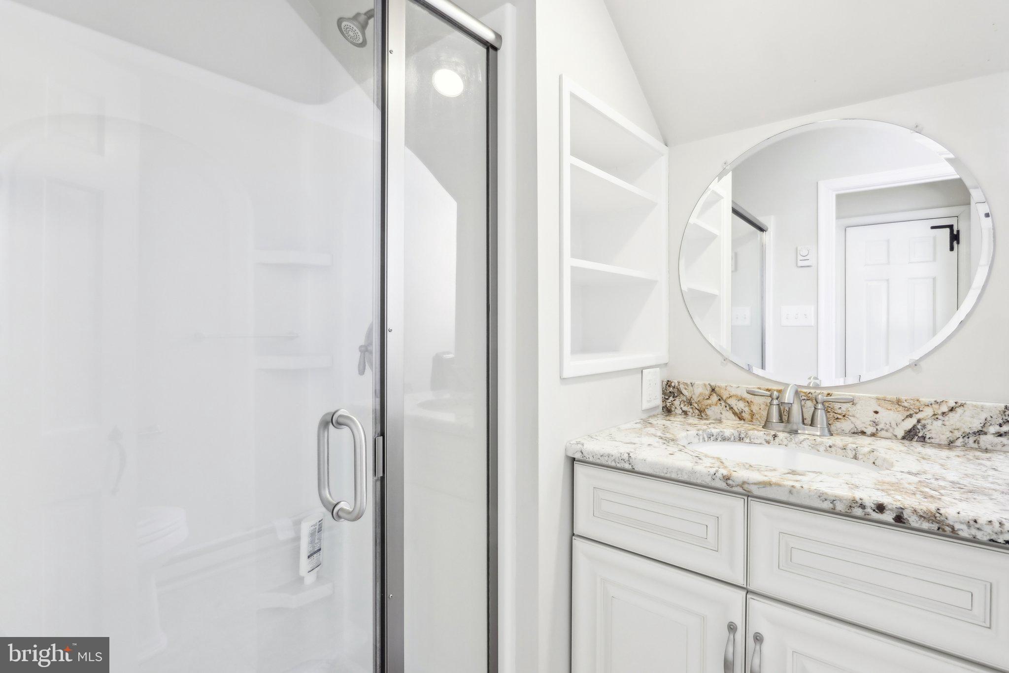 416 Dutton Mill Road Malvern, PA 19355 - Photo 37 of 56 a bathroom with a granite countertop sink and a mirror