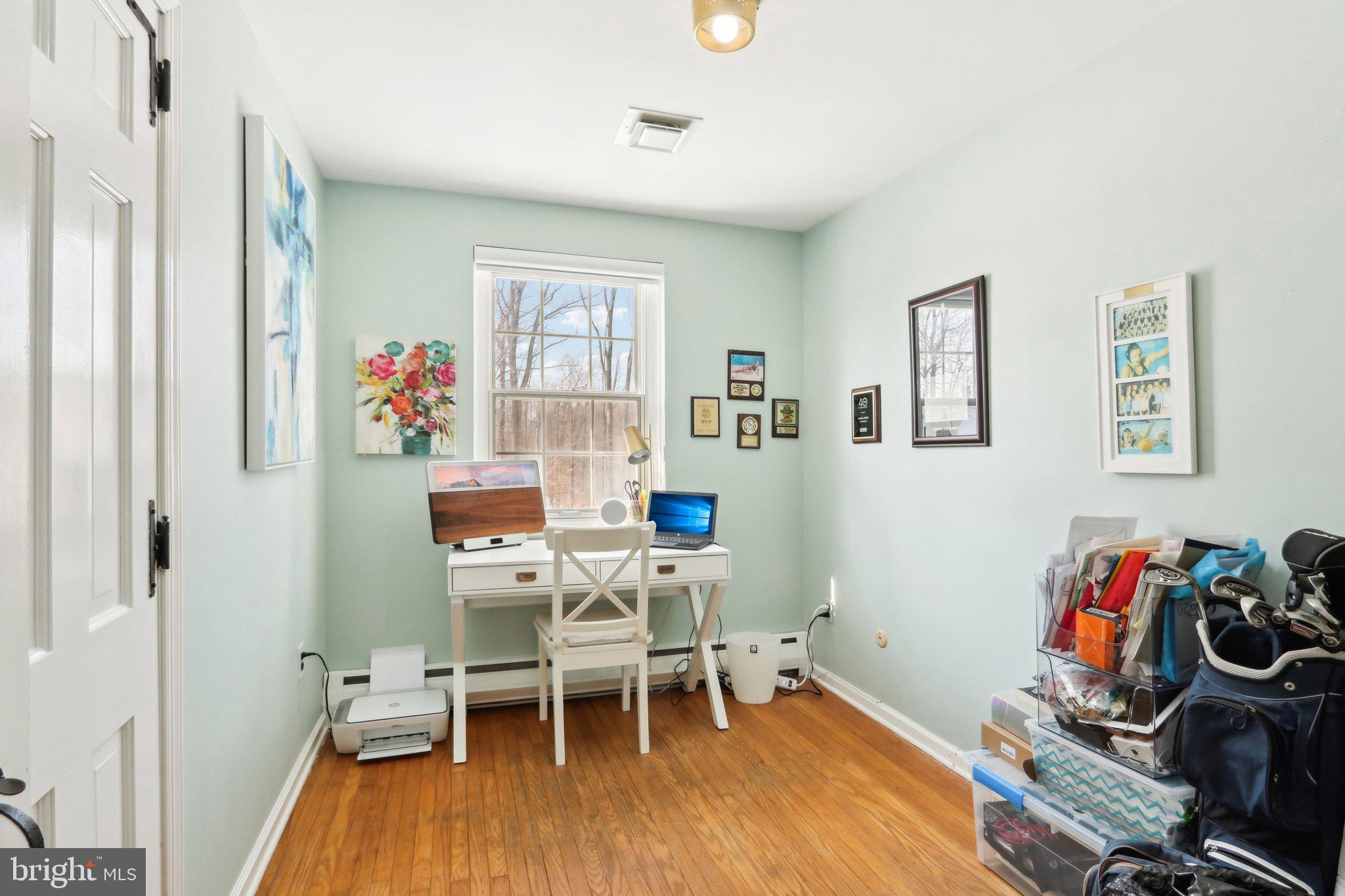416 Dutton Mill Road Malvern, PA 19355 - Photo 38 of 56 a workspace with furniture and wooden floor