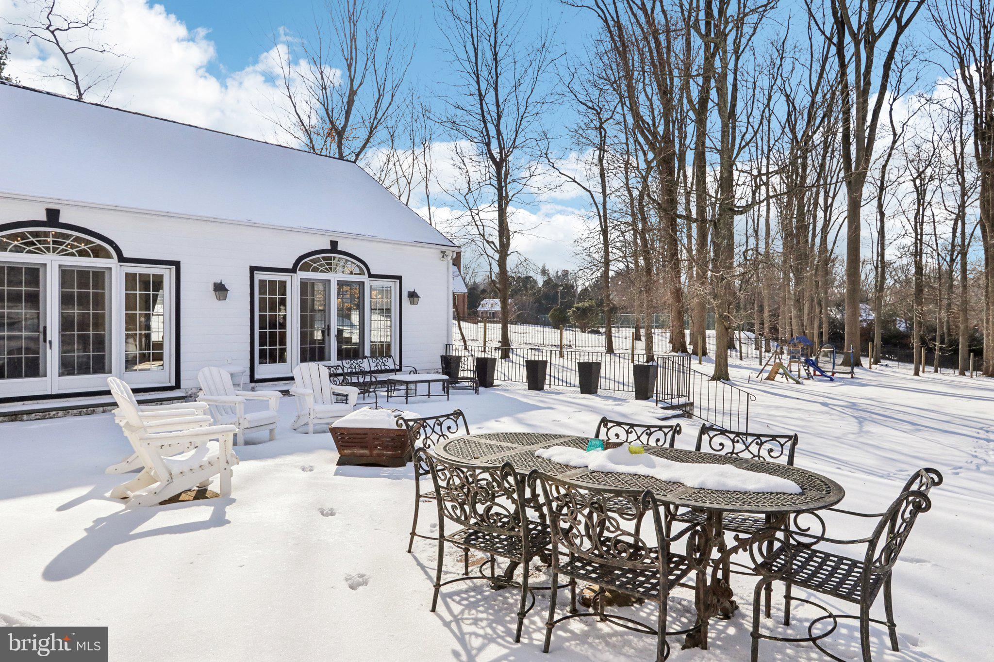 416 Dutton Mill Road Malvern, PA 19355 - Photo 47 of 56 a view of a dinning table and chairs in the patio