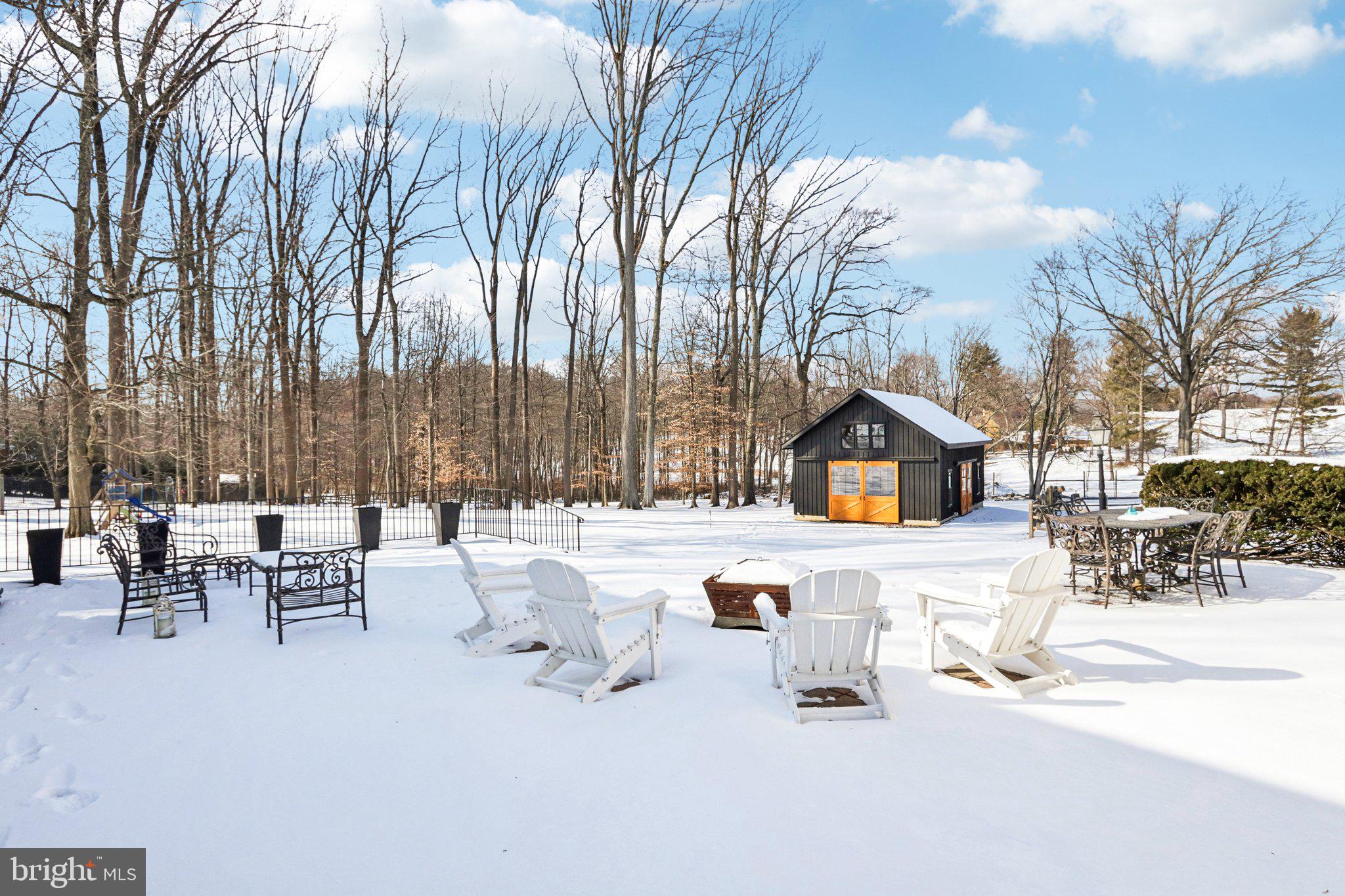 416 Dutton Mill Road Malvern, PA 19355 - Photo 48 of 56 a view of backyard with a table and chairs