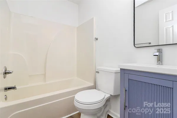 a bathroom with a sink a toilet and a bathtub