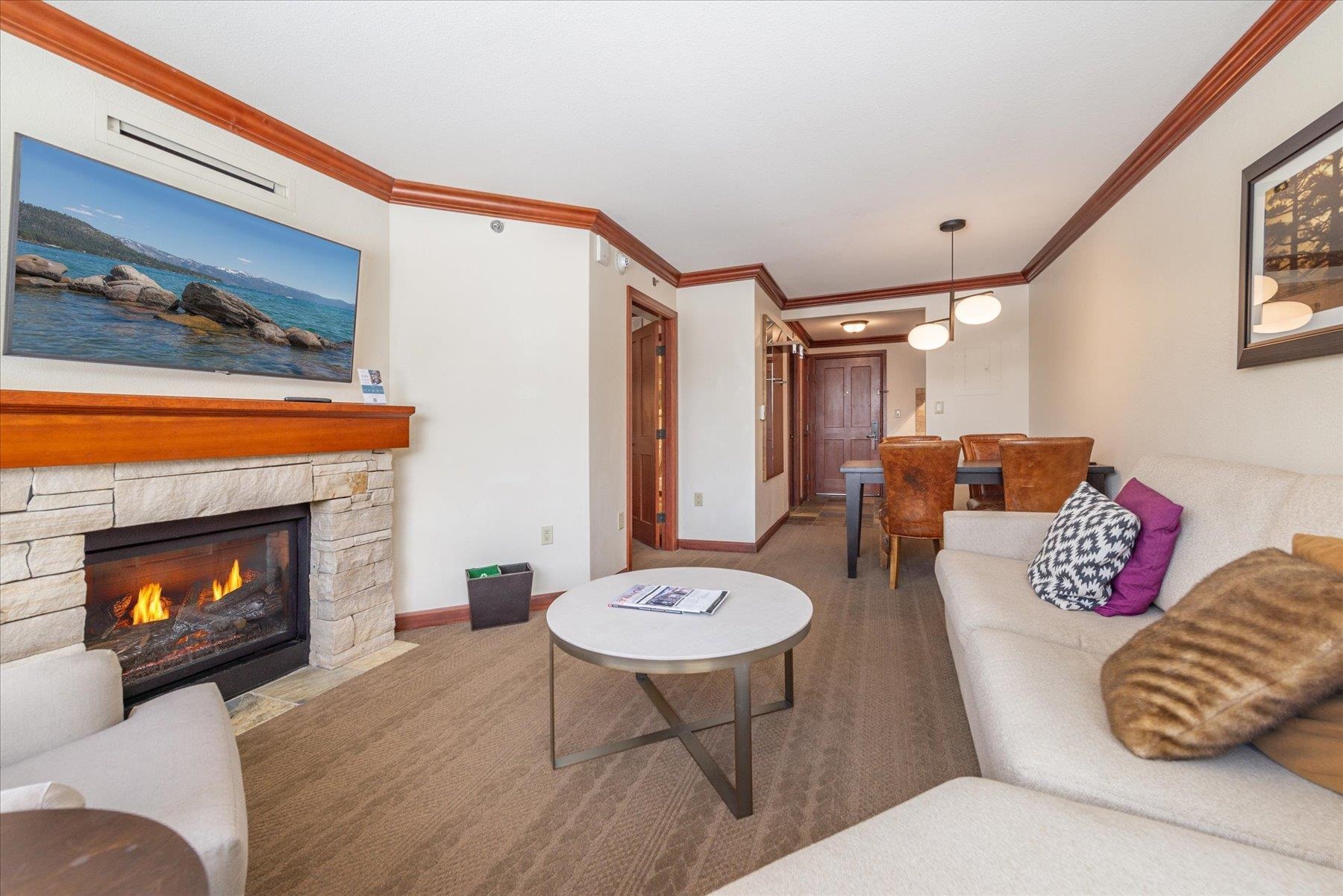400 Resort Road Olympic Valley, CA 96146 - Photo 2 of 28 a living room with furniture and a fireplace