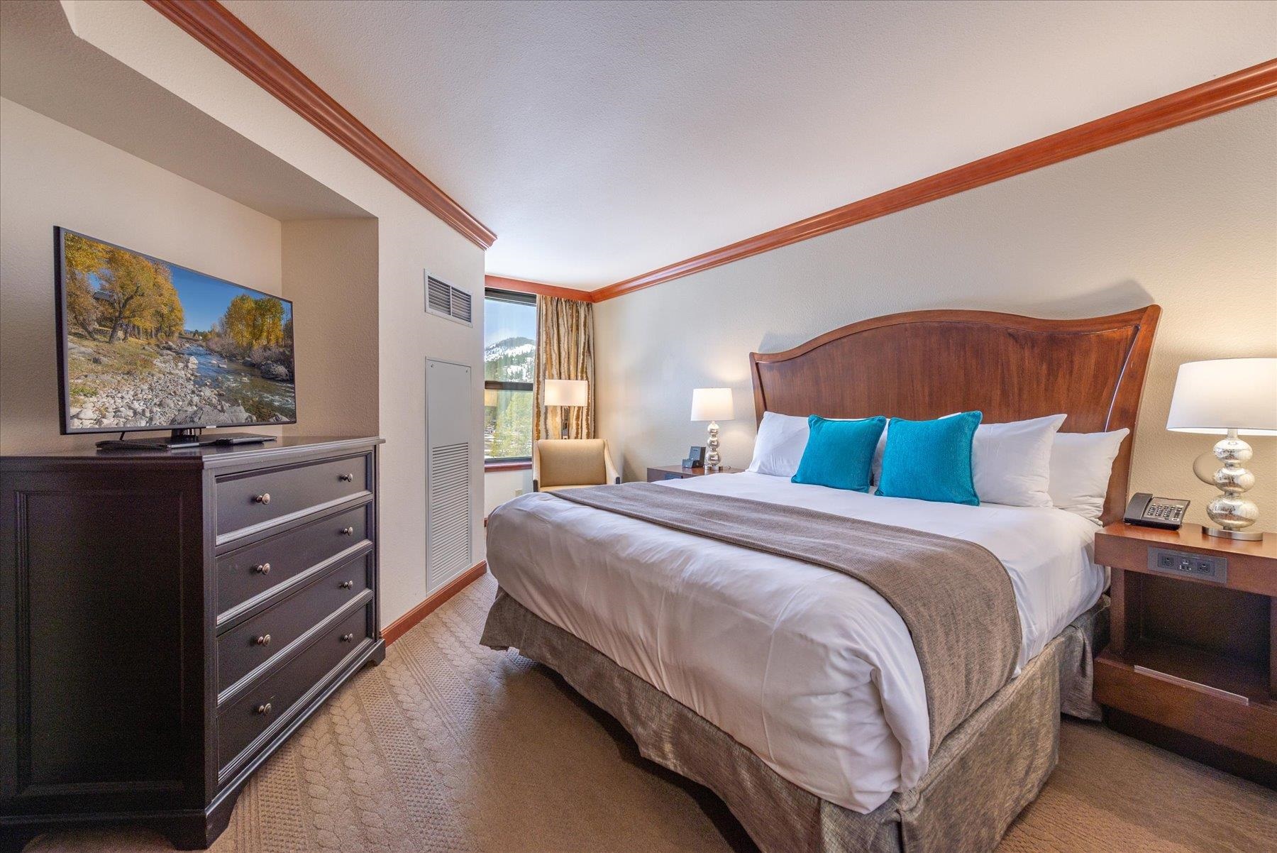 400 Resort Road Olympic Valley, CA 96146 - Photo 3 of 28 a bedroom with a bed and a dresser