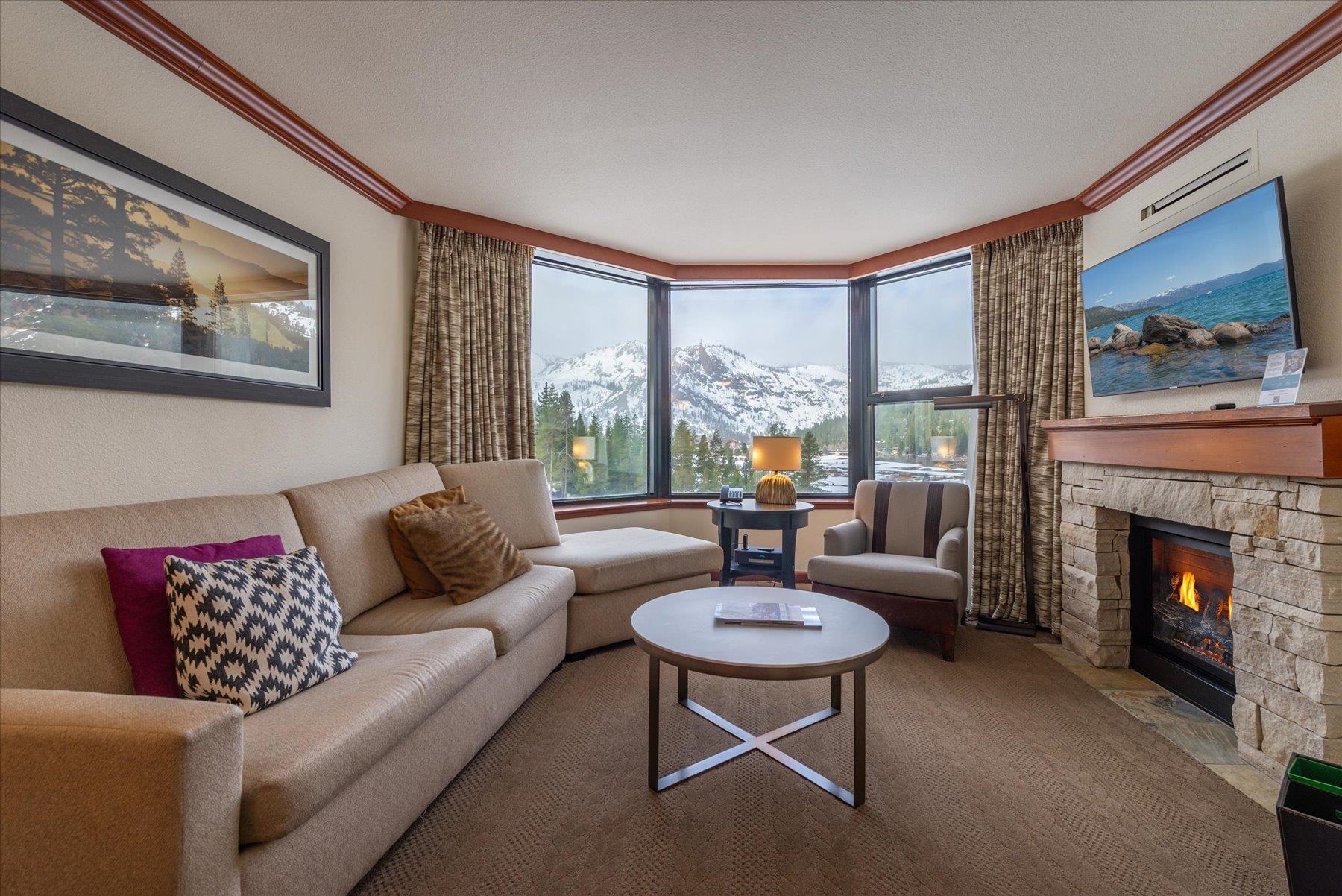 400 Resort Road Olympic Valley, CA 96146 - Photo 6 of 28 a living room with furniture and a fireplace