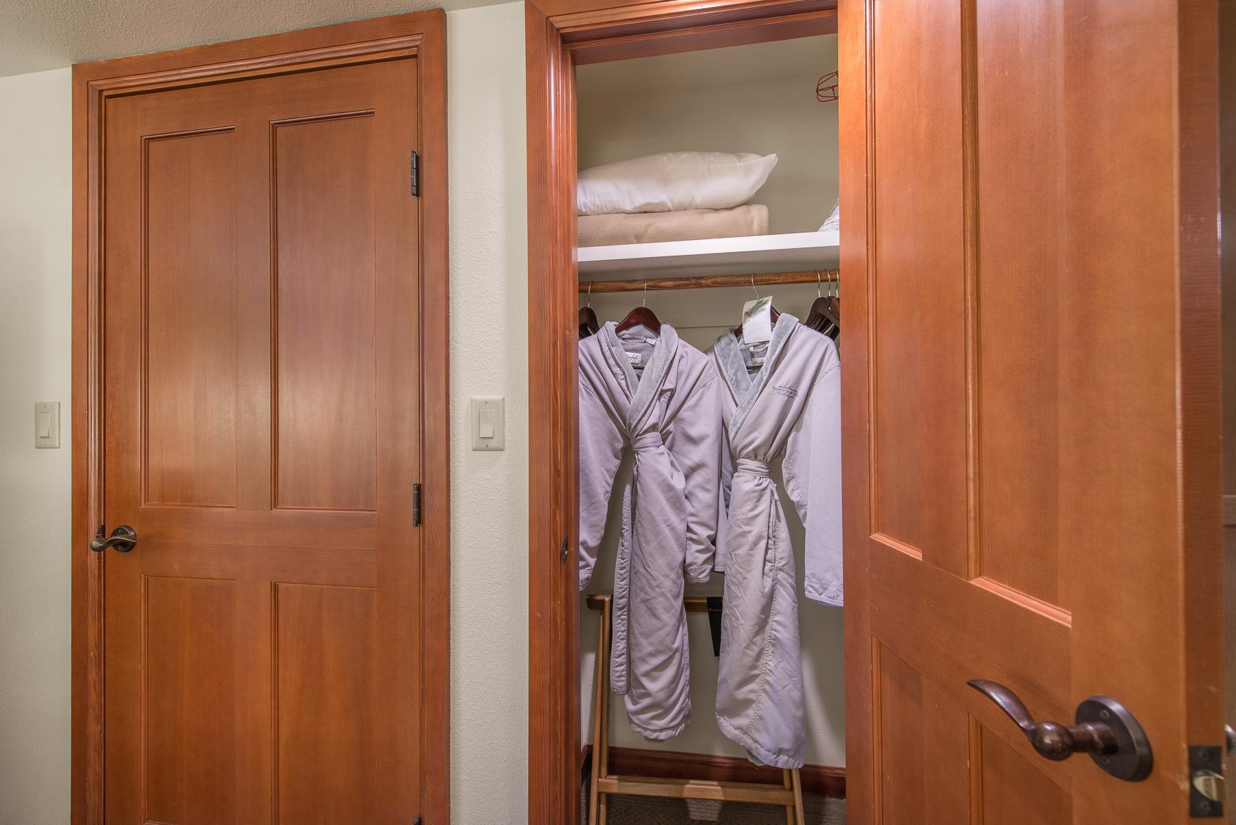 400 Resort Road Olympic Valley, CA 96146 - Photo 9 of 28 a bathroom with a mirror and a wooden door