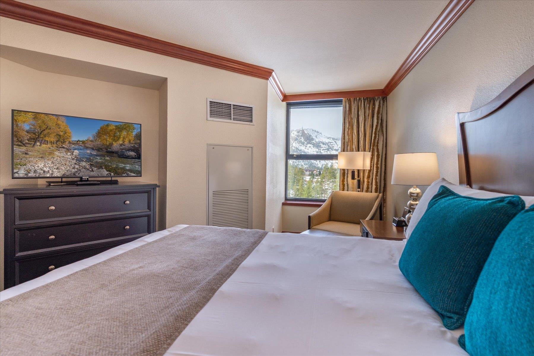 400 Resort Road Olympic Valley, CA 96146 - Photo 10 of 28 a bedroom with a bed and a dresser