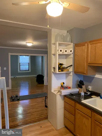 a kitchen with stainless steel appliances kitchen island granite countertop a sink and cabinets