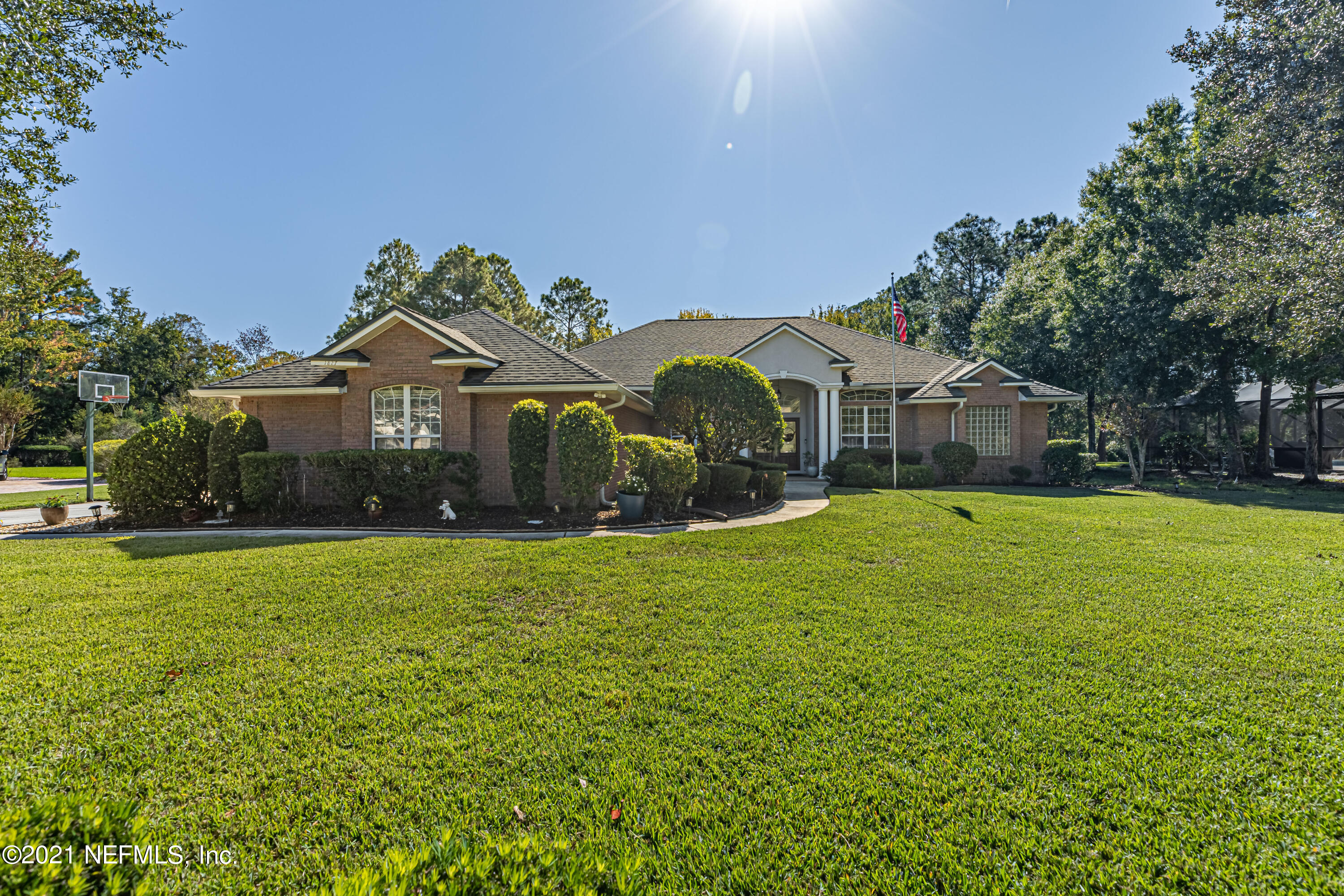 1827 Wild Grape Lane Fleming Island, FL 32003 - Photo 1 of 51 a front view of a house with yard and green space