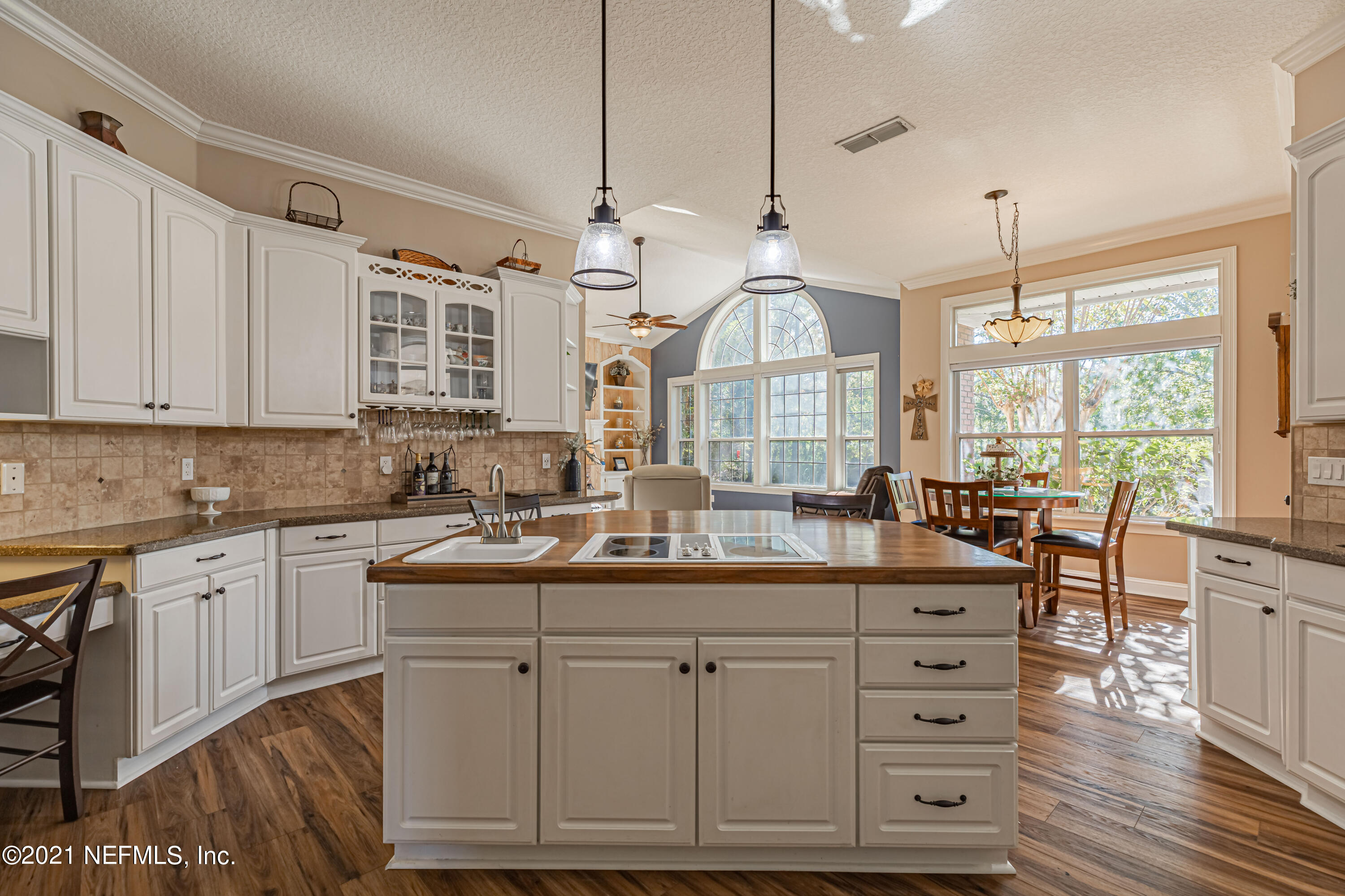 1827 Wild Grape Lane Fleming Island, FL 32003 - Photo 14 of 51 a kitchen with cabinets appliances and a center island