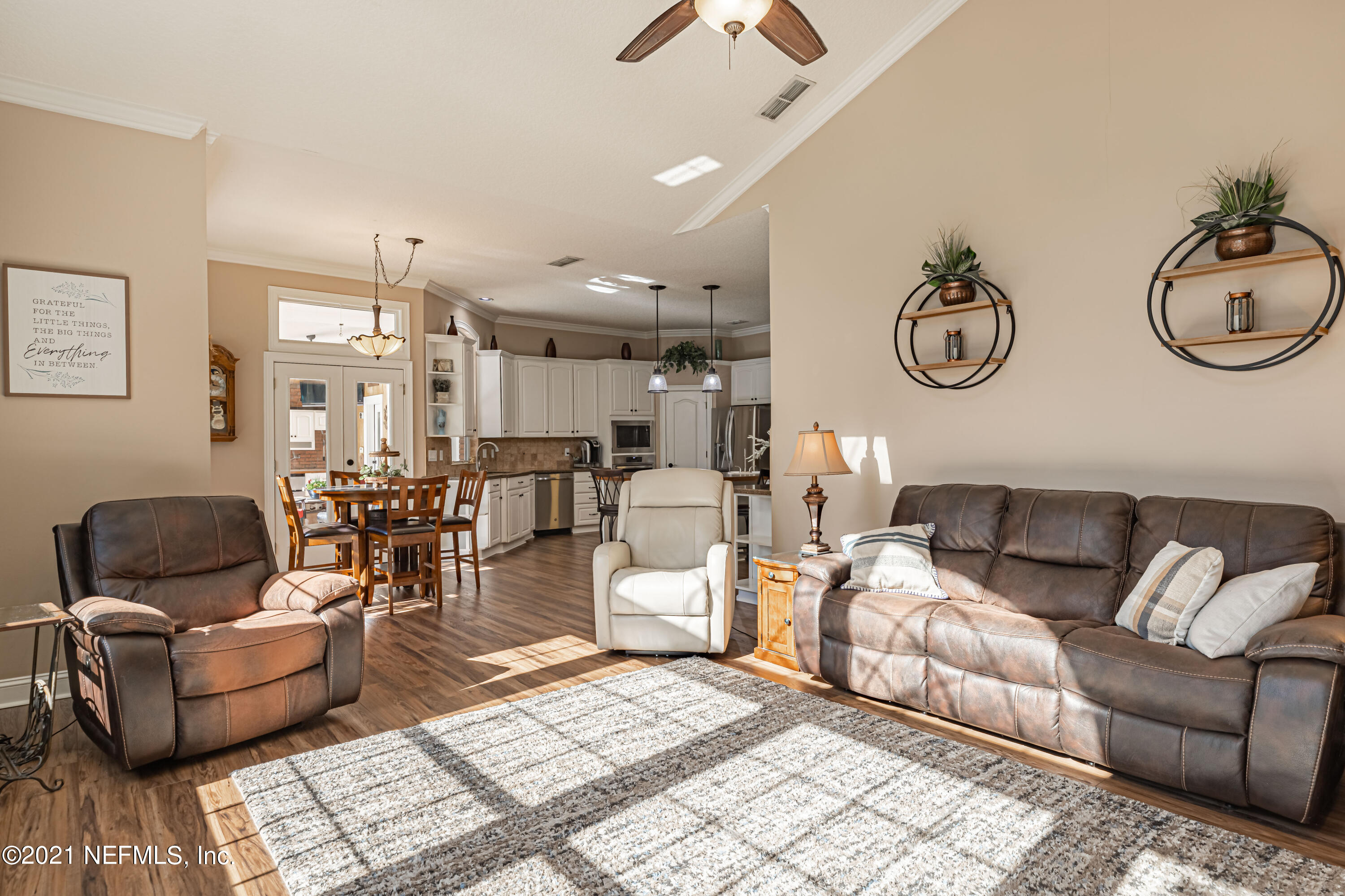 1827 Wild Grape Lane Fleming Island, FL 32003 - Photo 18 of 51 a living room with furniture and a window