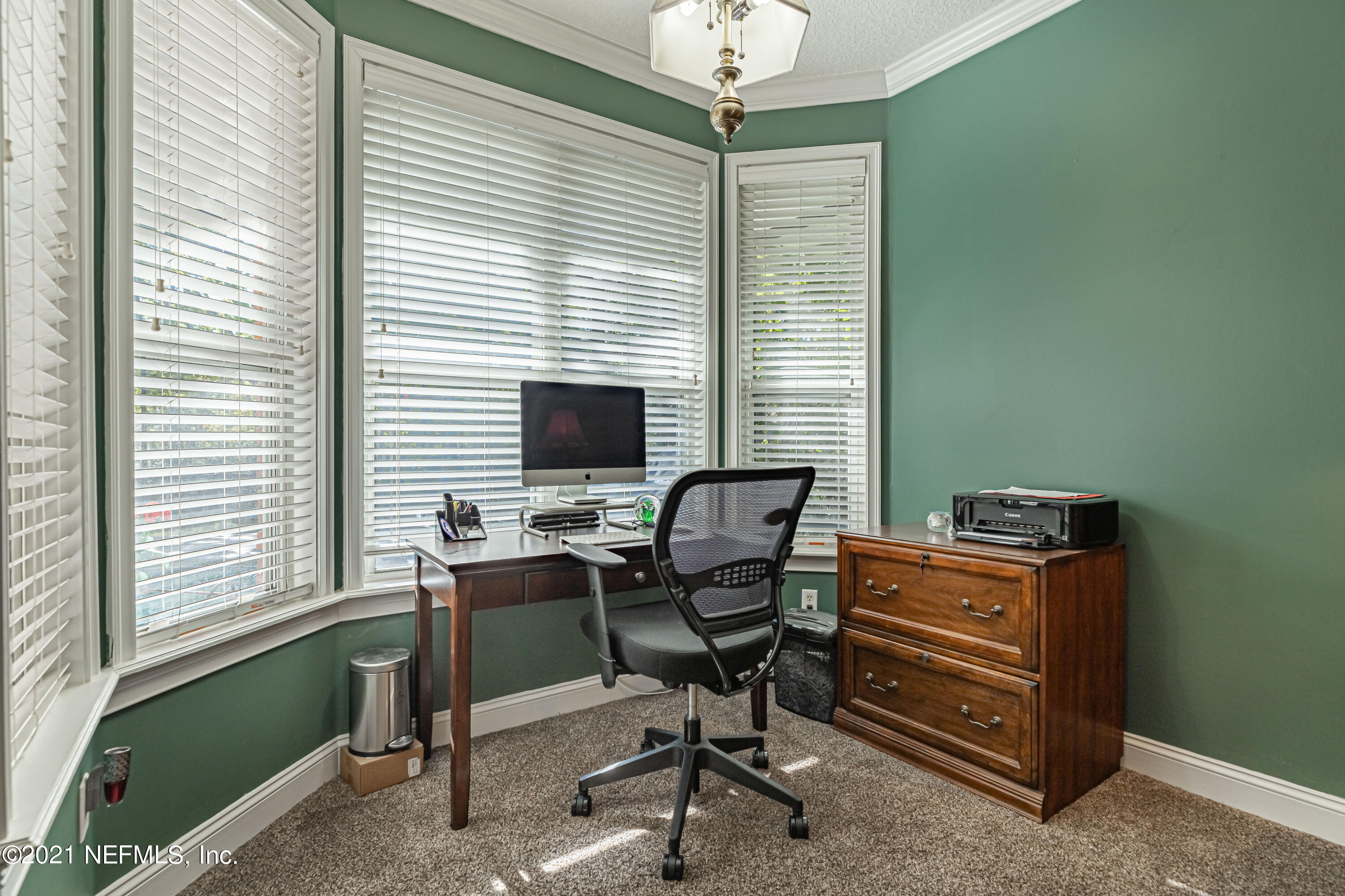 1827 Wild Grape Lane Fleming Island, FL 32003 - Photo 24 of 51 a view of a workspace with furniture and a window