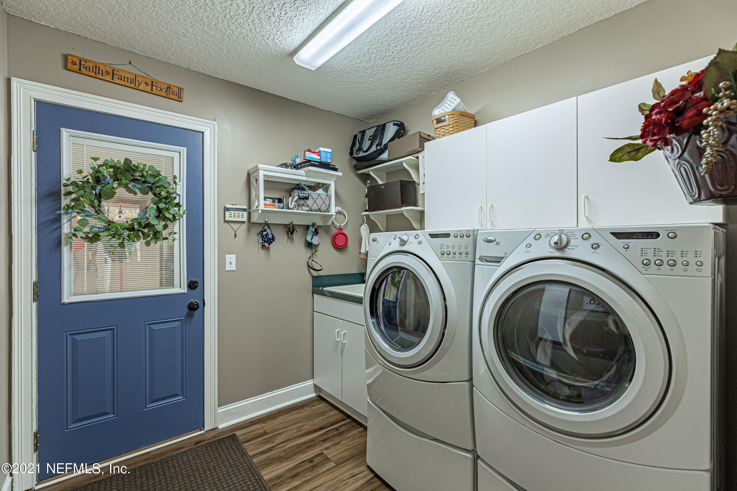 1827 Wild Grape Lane Fleming Island, FL 32003 - Photo 33 of 51 a utility room with dryer and washer