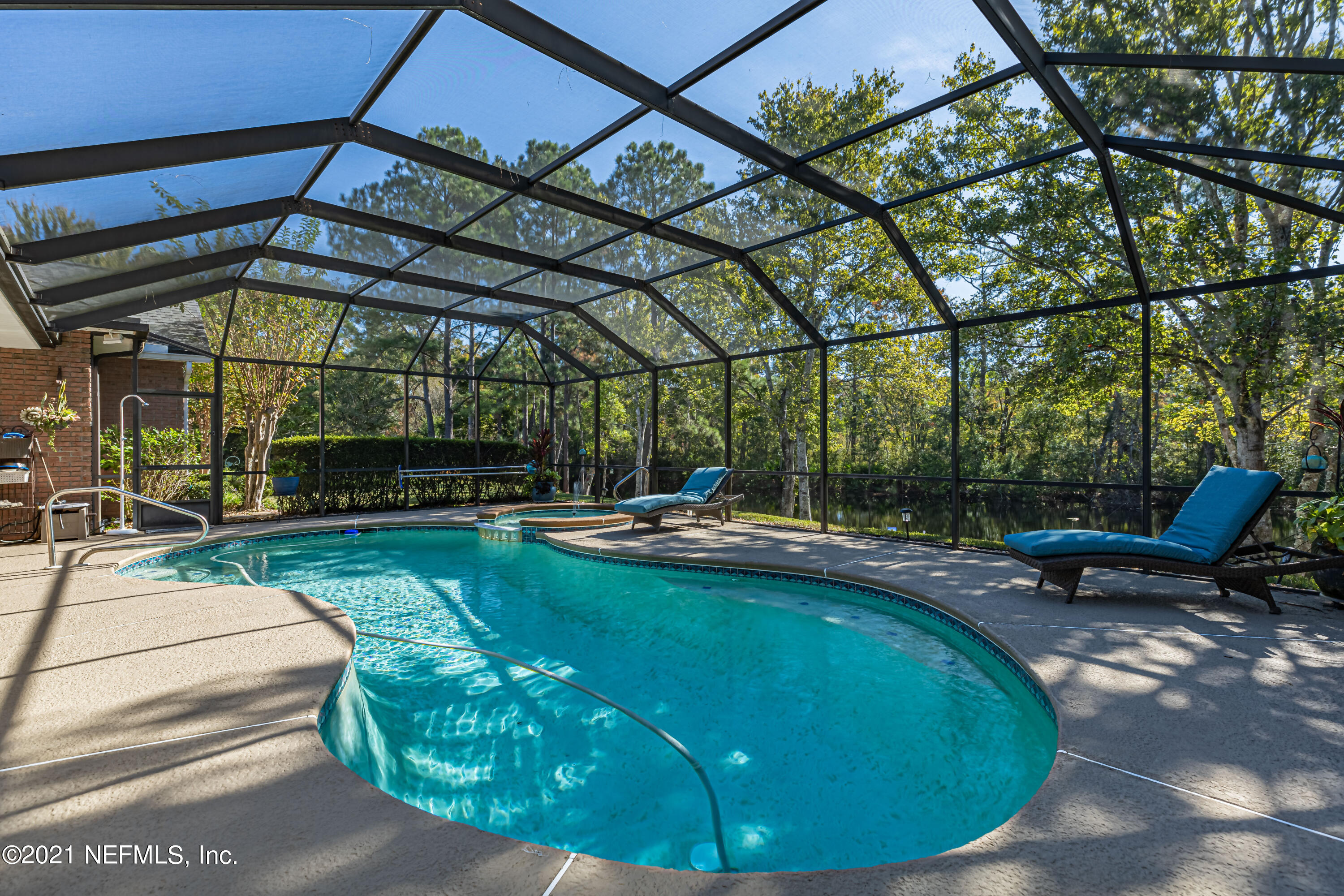 1827 Wild Grape Lane Fleming Island, FL 32003 - Photo 37 of 51 a view of a swimming pool with a patio