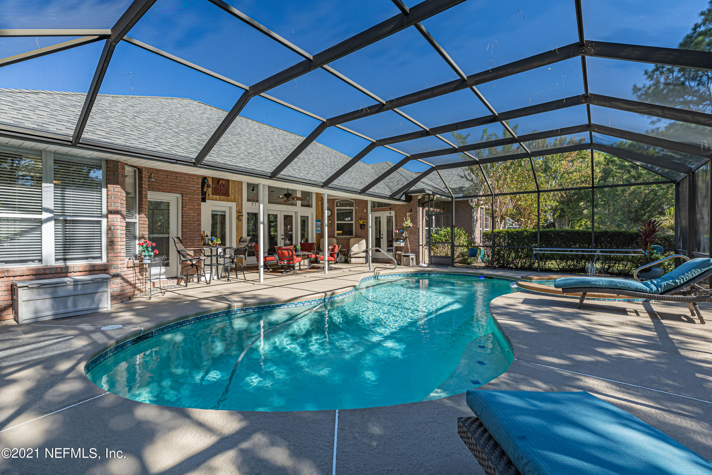 1827 Wild Grape Lane Fleming Island, FL 32003 - Photo 38 of 51 a view of a swimming pool with a patio