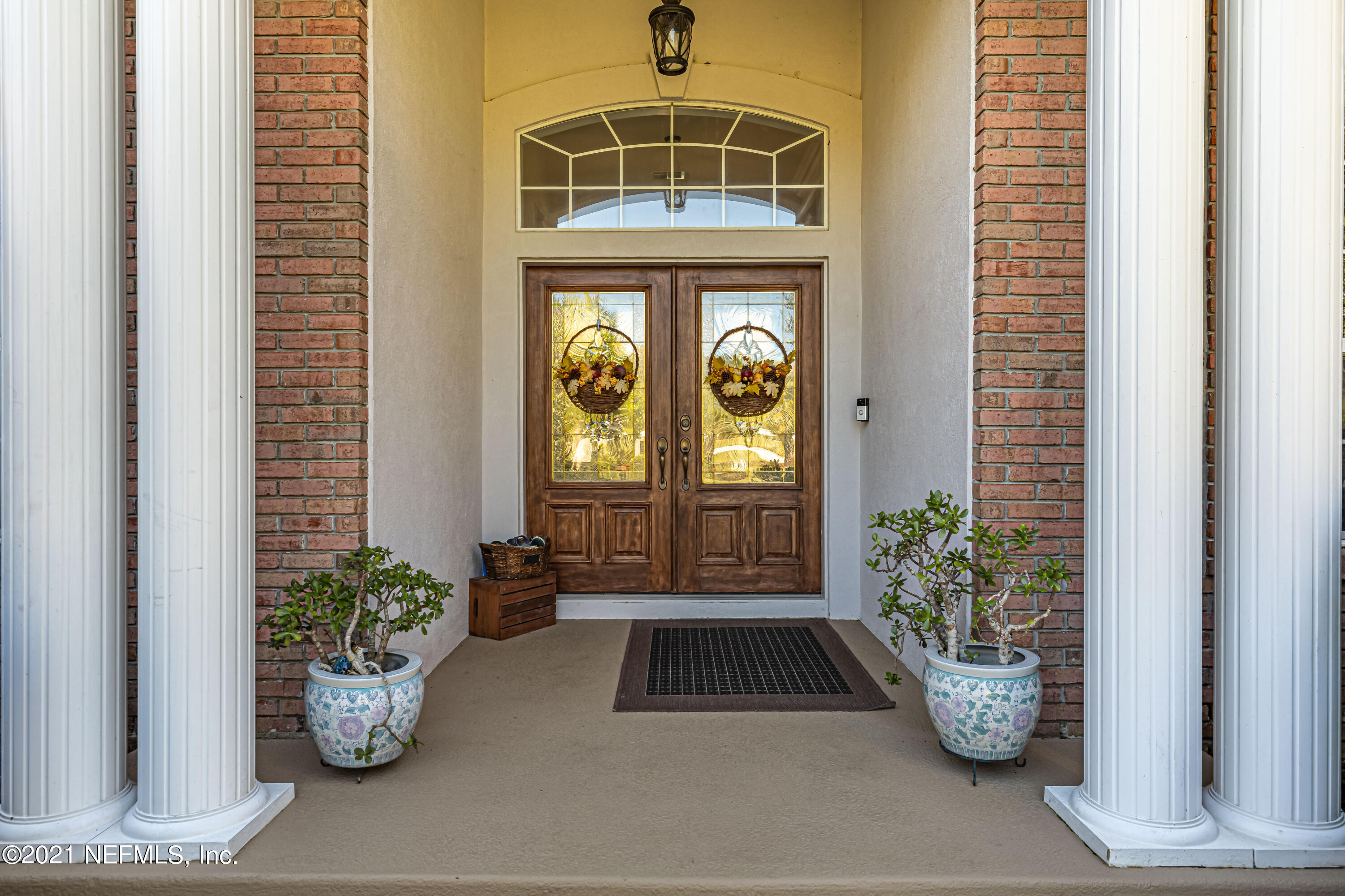 1827 Wild Grape Lane Fleming Island, FL 32003 - Photo 4 of 51 a potted plant sitting on the side of a building
