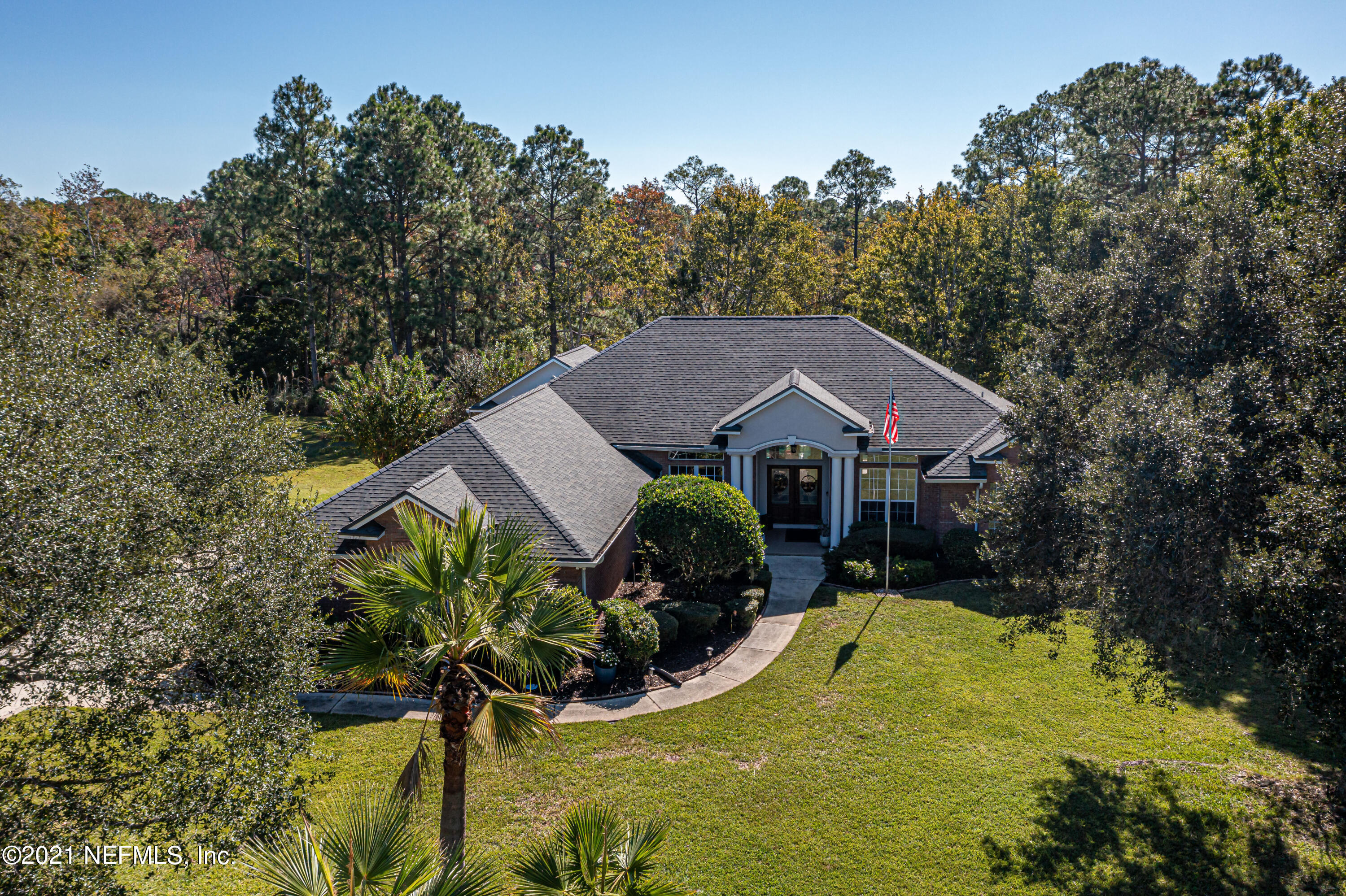 1827 Wild Grape Lane Fleming Island, FL 32003 - Photo 45 of 51 a view of a house with a yard and sitting area