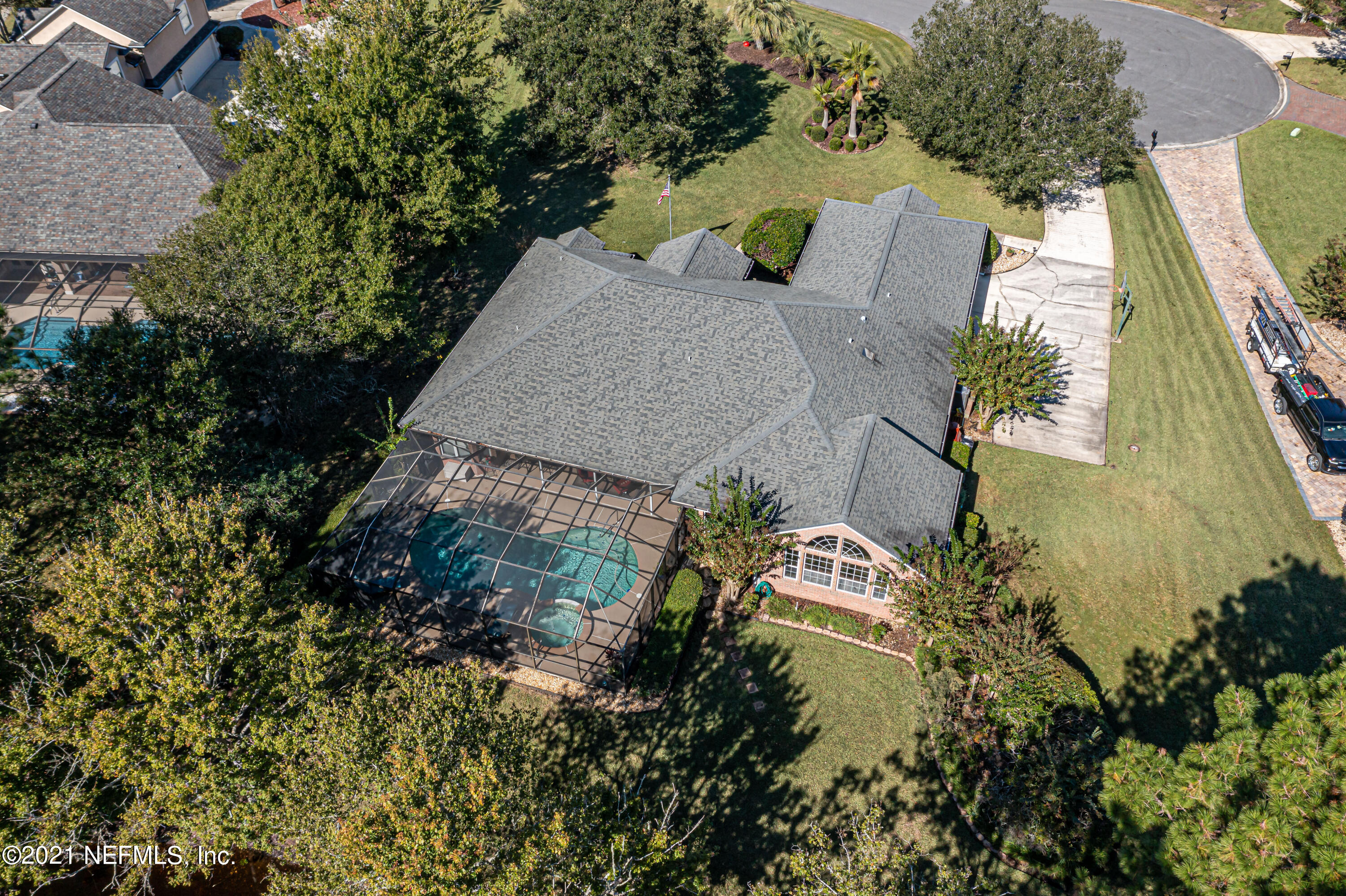 1827 Wild Grape Lane Fleming Island, FL 32003 - Photo 49 of 51 an aerial view of a house with a yard and wooden fence
