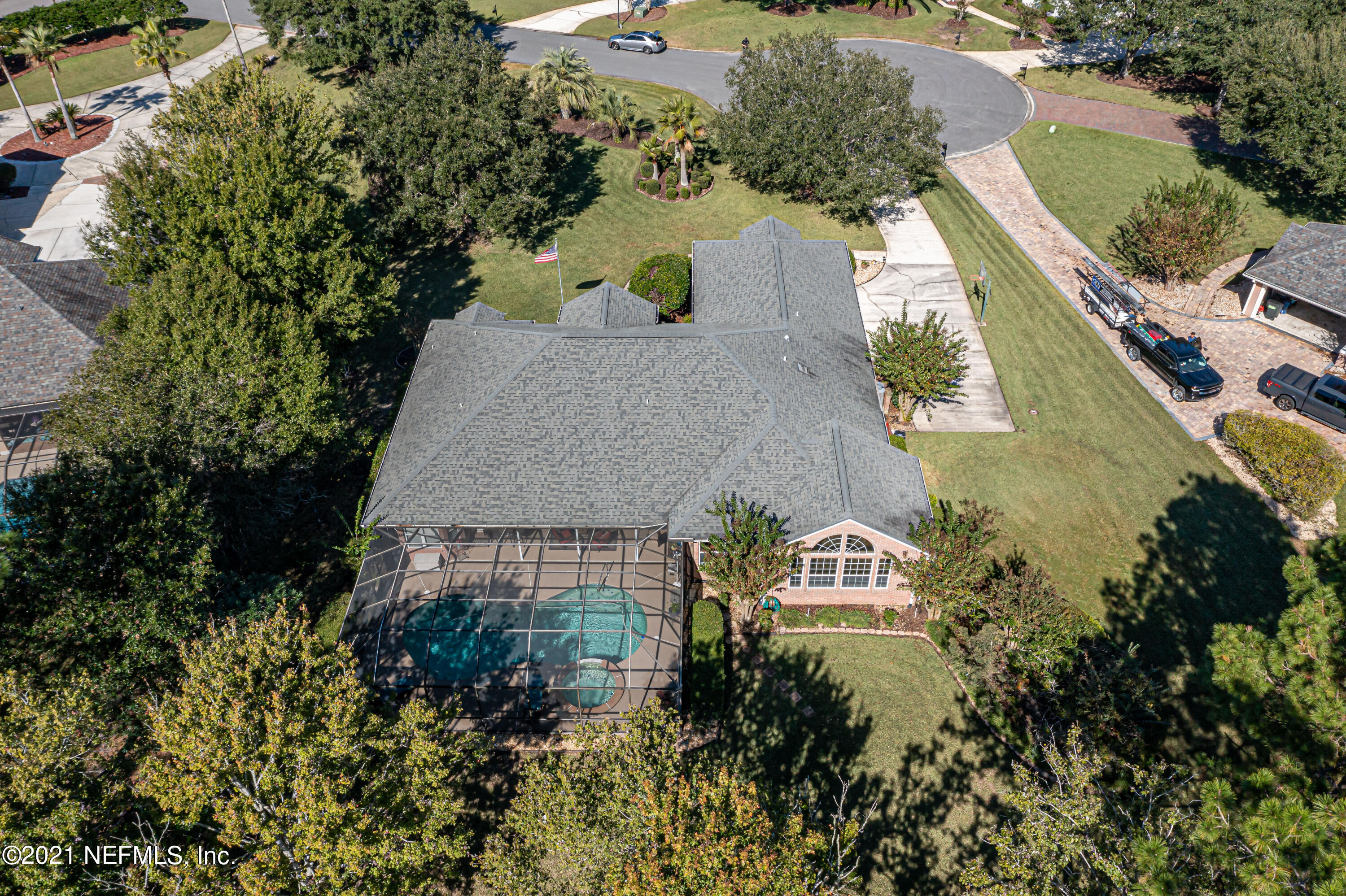 1827 Wild Grape Lane Fleming Island, FL 32003 - Photo 50 of 51 an aerial view of a house with a garden and trees all around