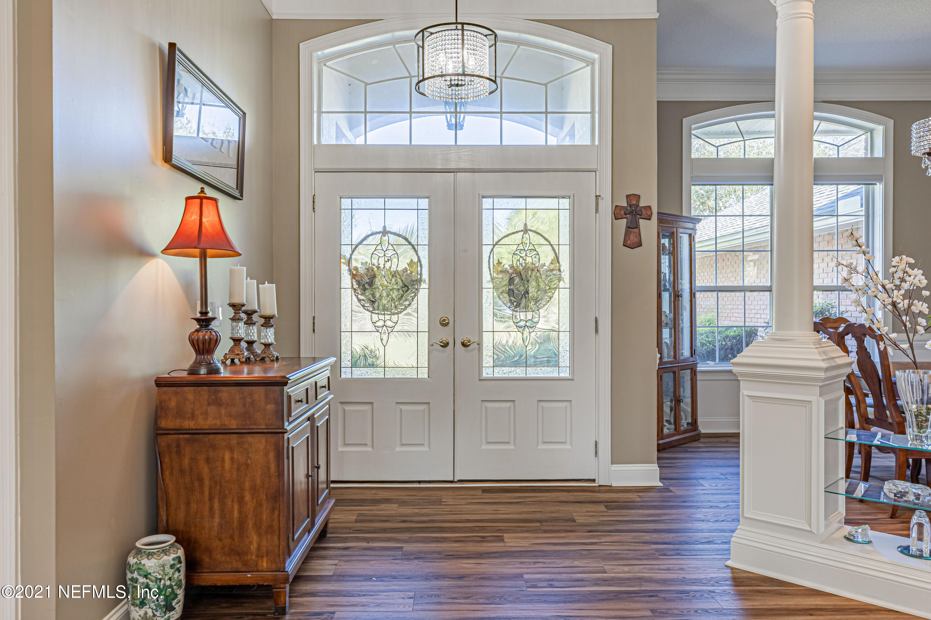 1827 Wild Grape Lane Fleming Island, FL 32003 - Photo 5 of 51 a view of a livingroom with furniture hardwood floor and a chandelier