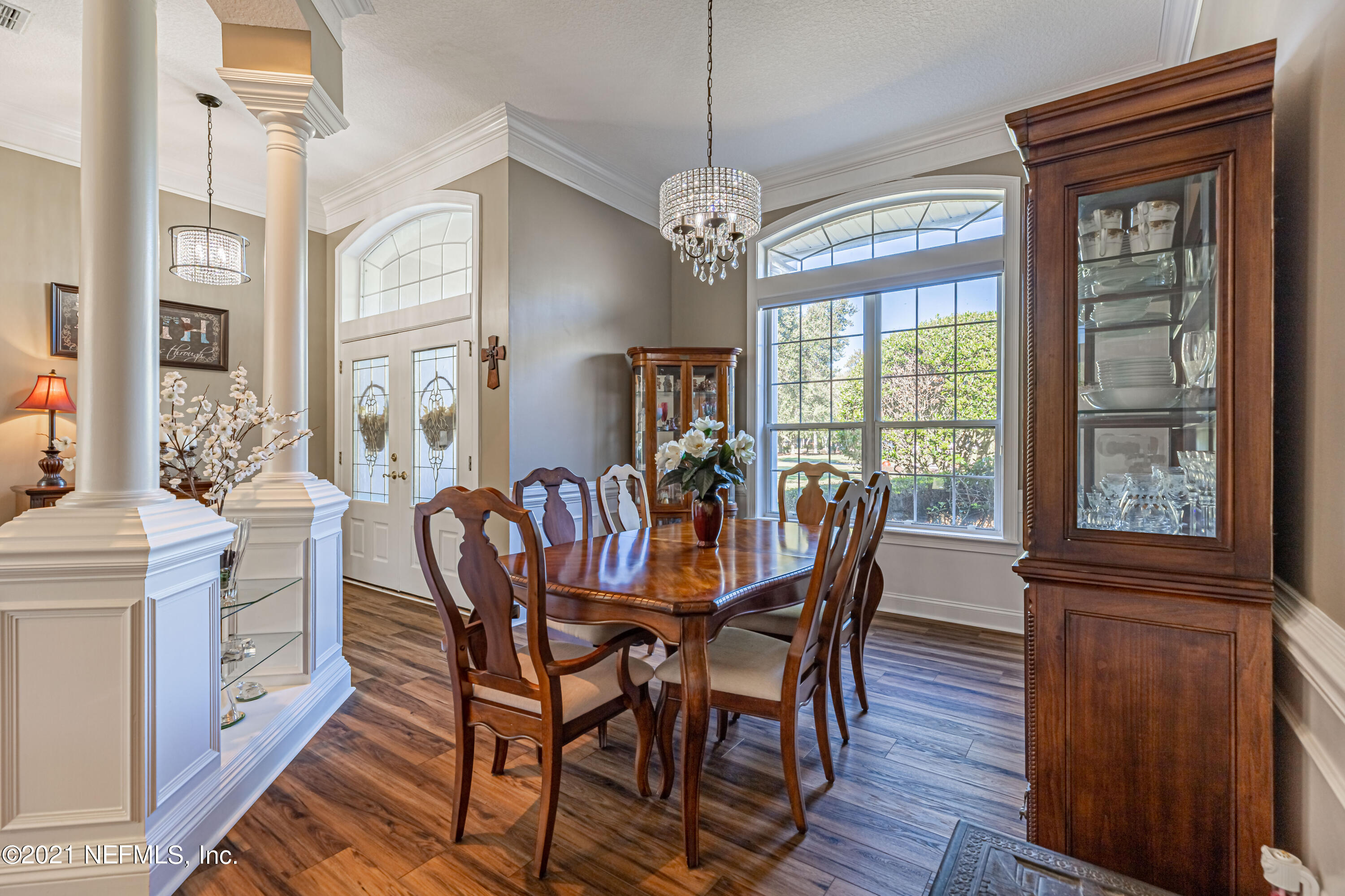 1827 Wild Grape Lane Fleming Island, FL 32003 - Photo 6 of 51 a view of a dining room with furniture window and wooden floor
