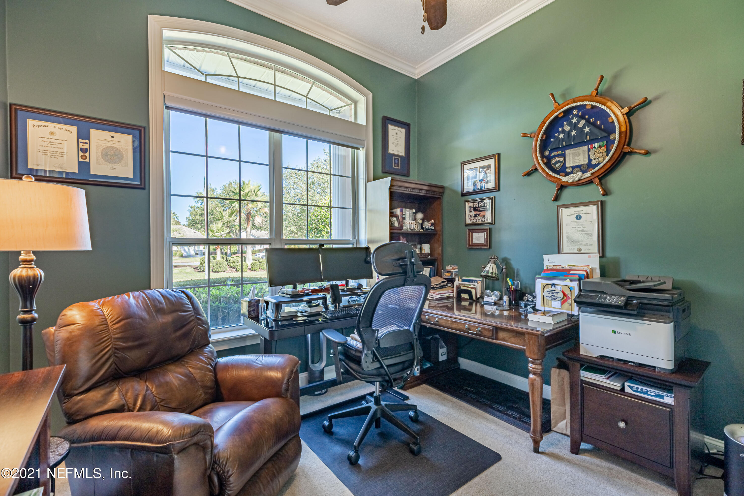 1827 Wild Grape Lane Fleming Island, FL 32003 - Photo 7 of 51 a living room with furniture a floor to ceiling window and wooden floor