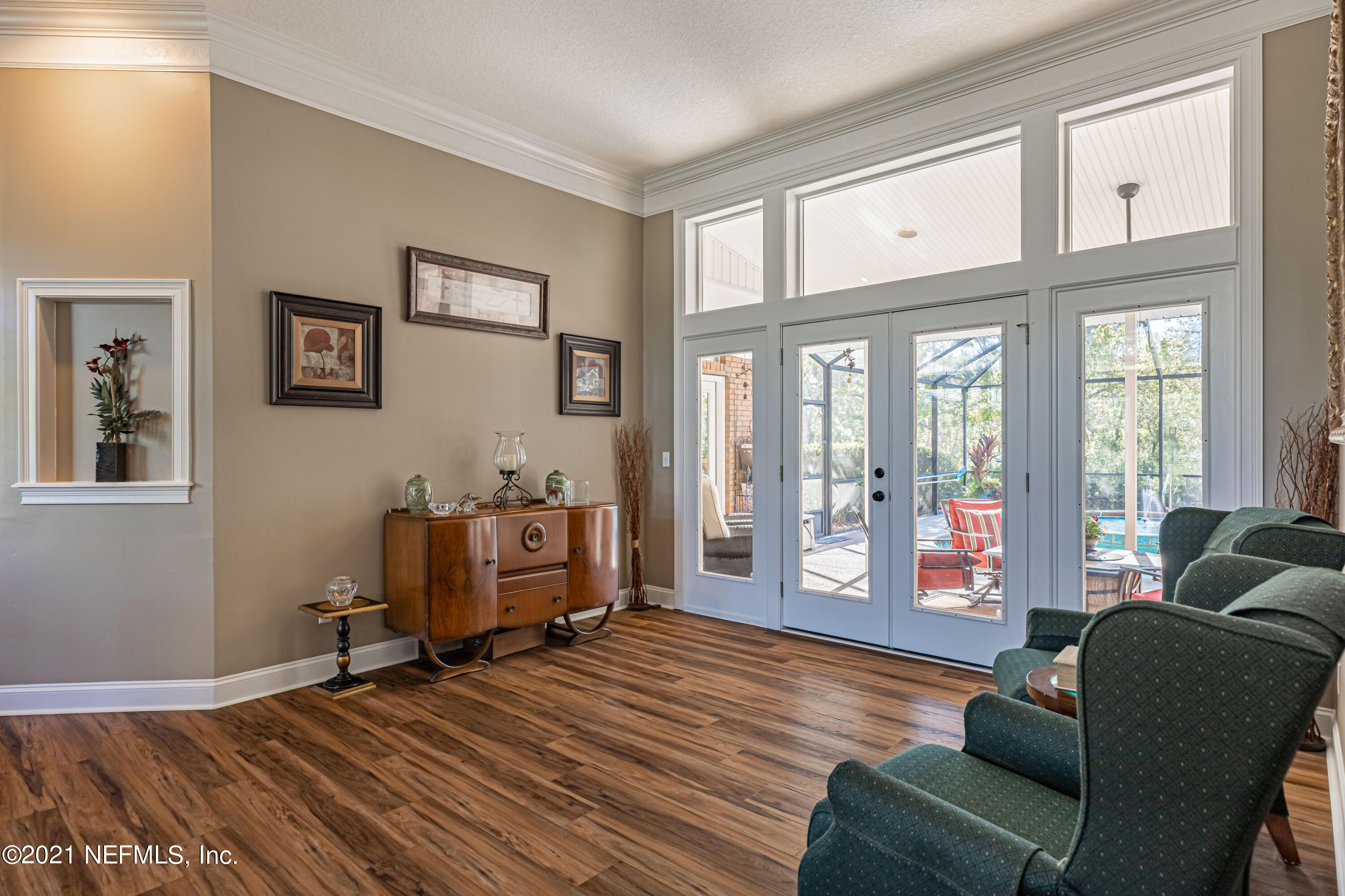 1827 Wild Grape Lane Fleming Island, FL 32003 - Photo 9 of 51 a living room with furniture and large window