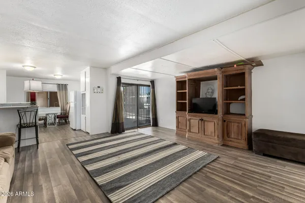 a spacious bedroom with a bed and a large window