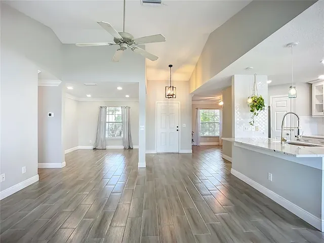 a view of an entryway with wooden floors