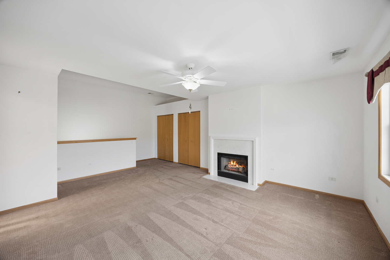 848 Havenshire Road, Unit 848 Naperville, IL 60565 - Photo 17 of 23 a view of an empty room with a fireplace and a window