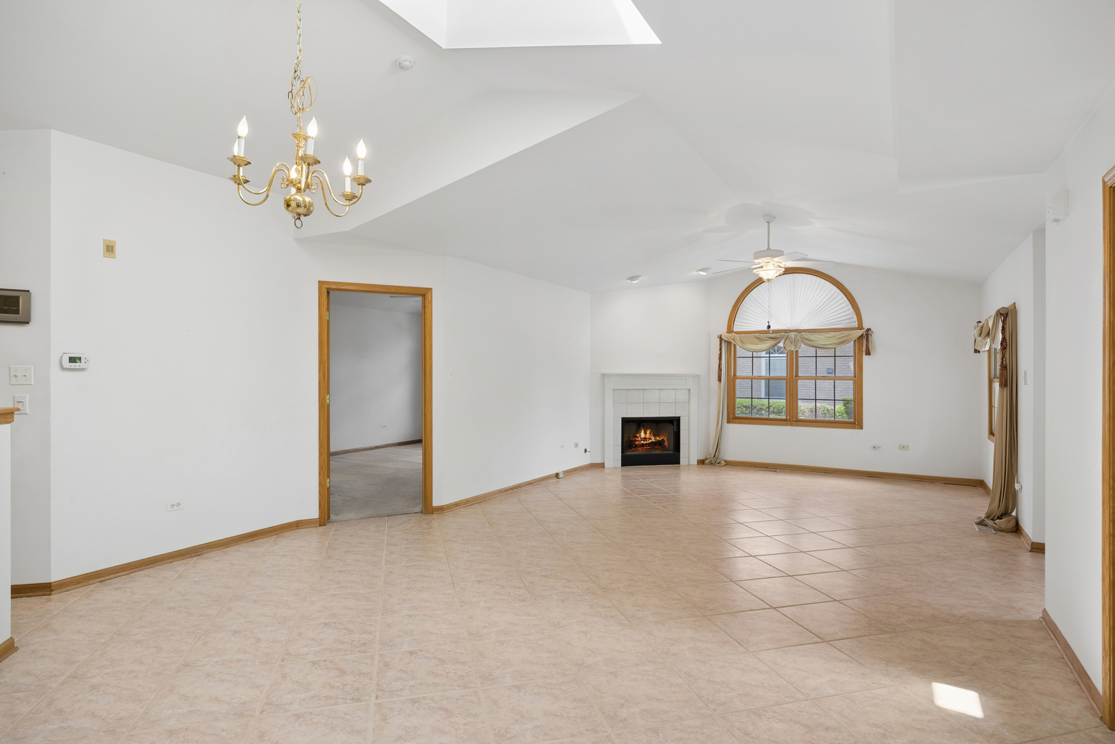 848 Havenshire Road, Unit 848 Naperville, IL 60565 - Photo 4 of 23 a view of an empty room with a fireplace