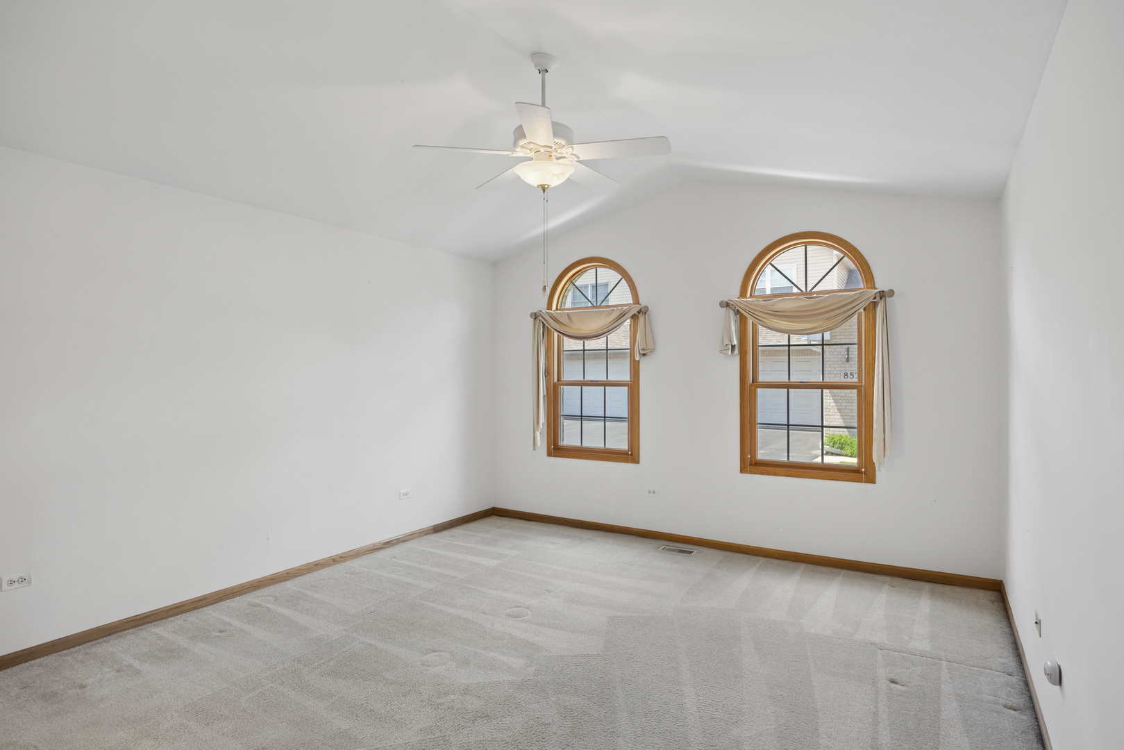848 Havenshire Road, Unit 848 Naperville, IL 60565 - Photo 6 of 23 an empty room with a fan and a window