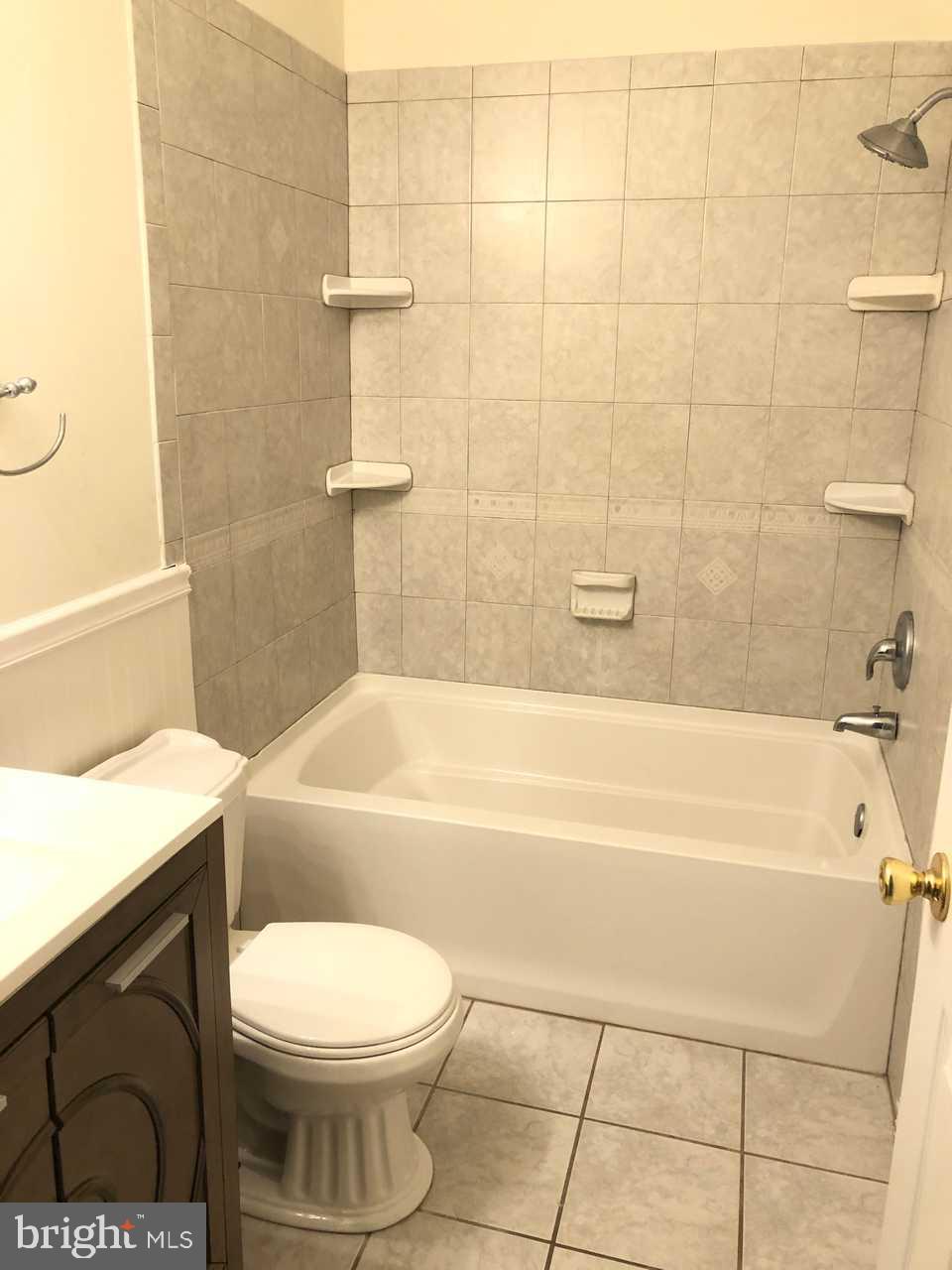 332 Cold Spring Place Dover, DE 19904 - Photo 15 of 30 a bathroom with a toilet a sink and bathtub