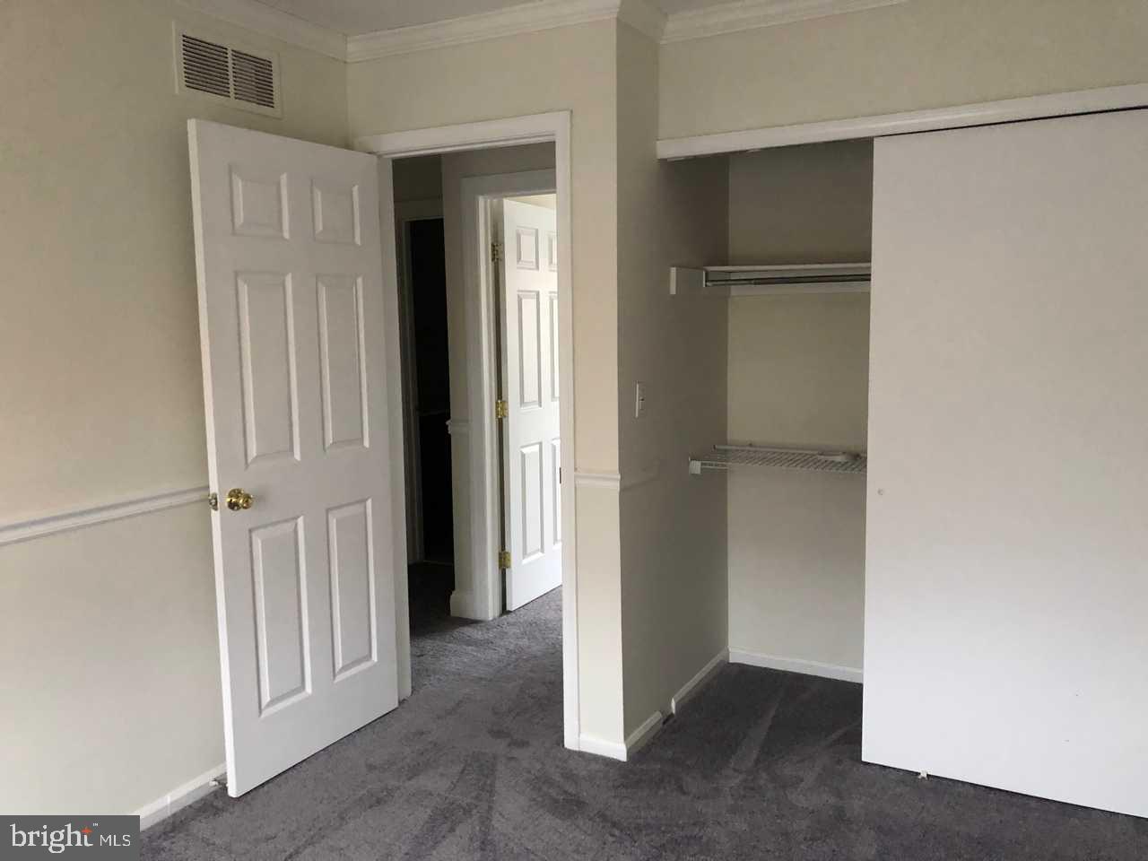 332 Cold Spring Place Dover, DE 19904 - Photo 22 of 30 a view of a hallway with closet and wooden floor