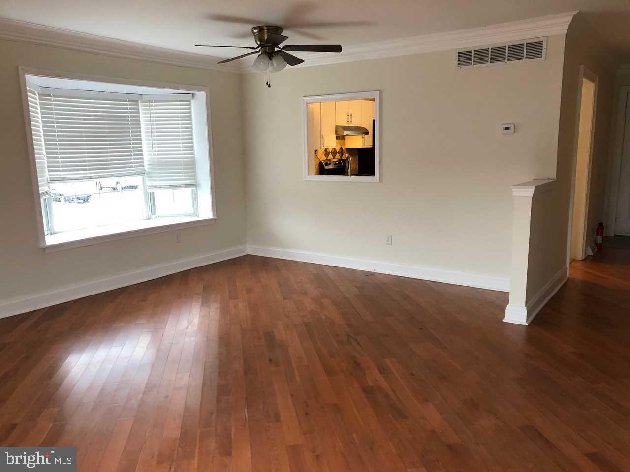 332 Cold Spring Place Dover, DE 19904 - Photo 5 of 30 a view of empty room with wooden floor and fan