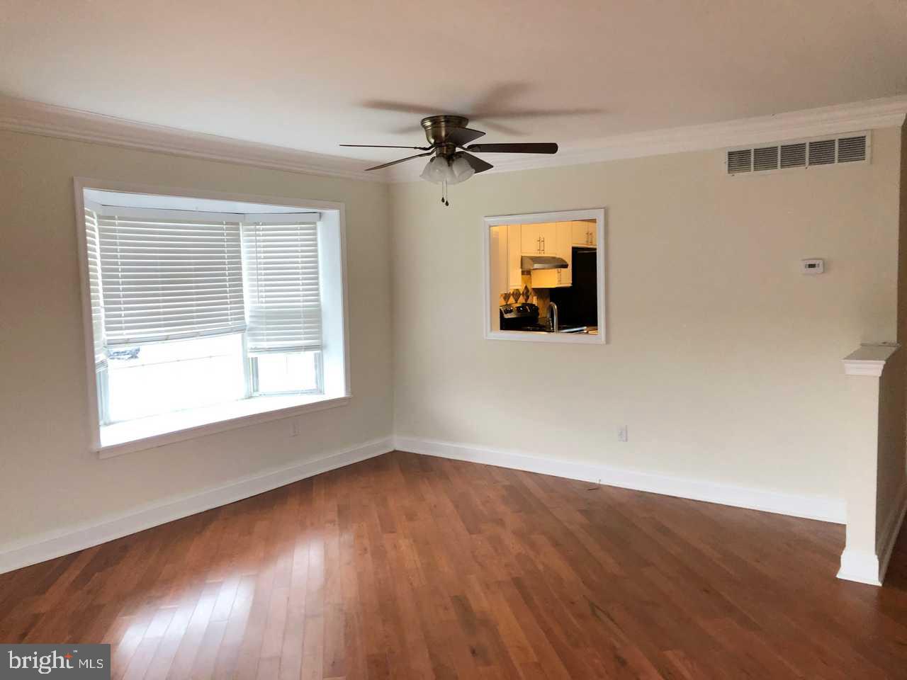 332 Cold Spring Place Dover, DE 19904 - Photo 7 of 30 wooden floor in an empty room with a window
